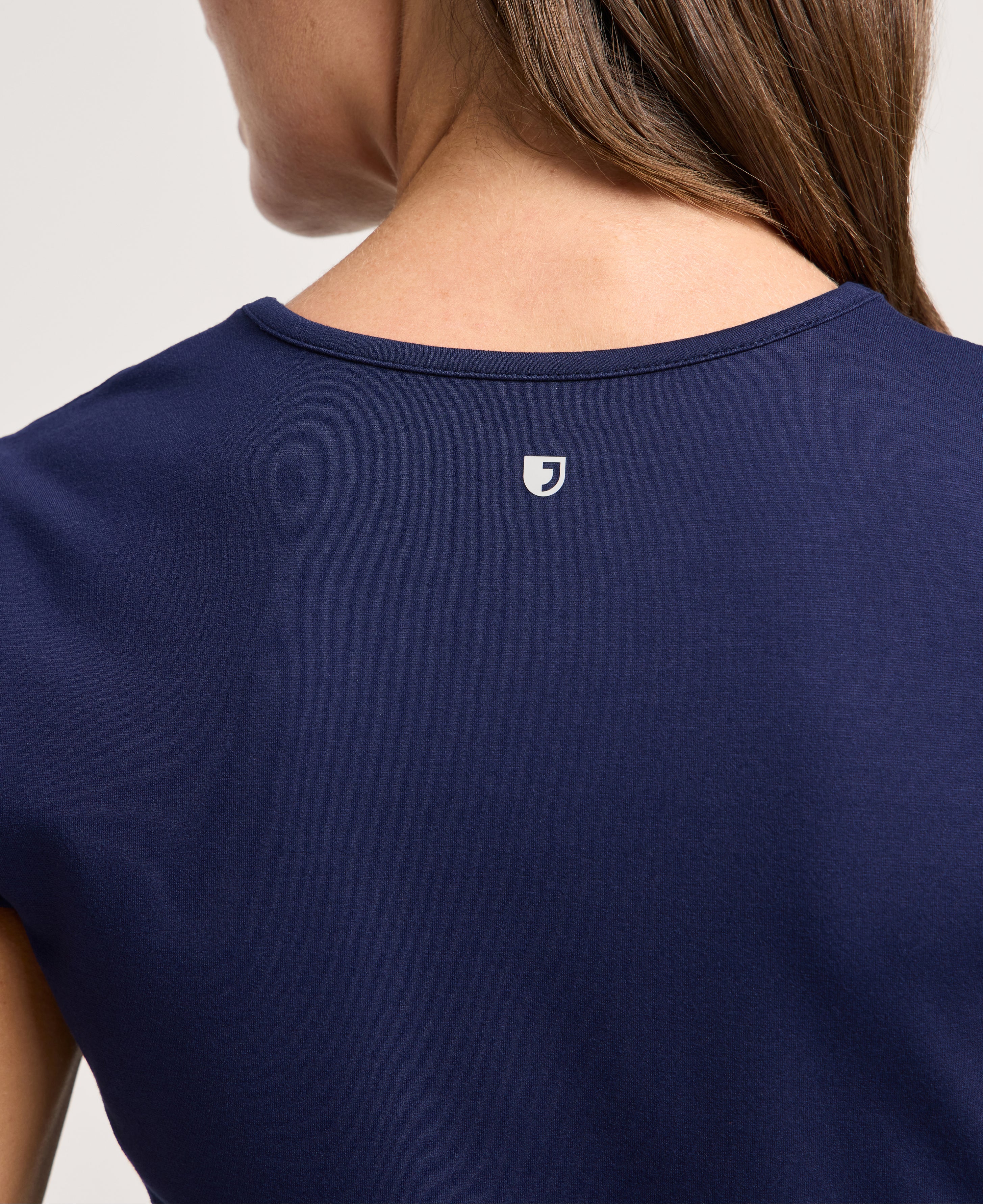 Jaanuu Isla Mock-Wrap Scrub Top in Midnight Navy, product photo 5 of 6