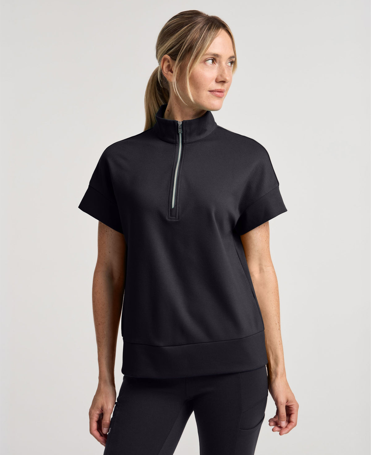 Jaanuu Noam Boxy Scrub Top in Black, product photo 1 of 6