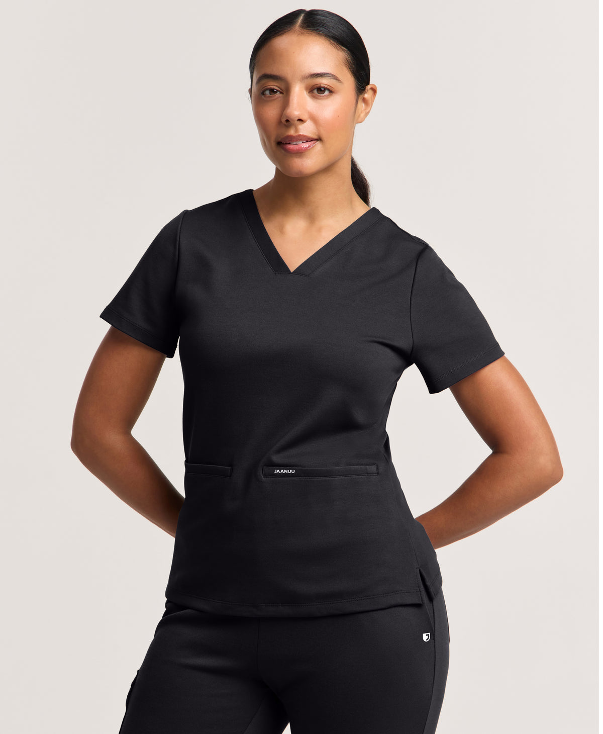 Jaanuu Cesi Slim Scrub Top in Black, product photo 1 of 6