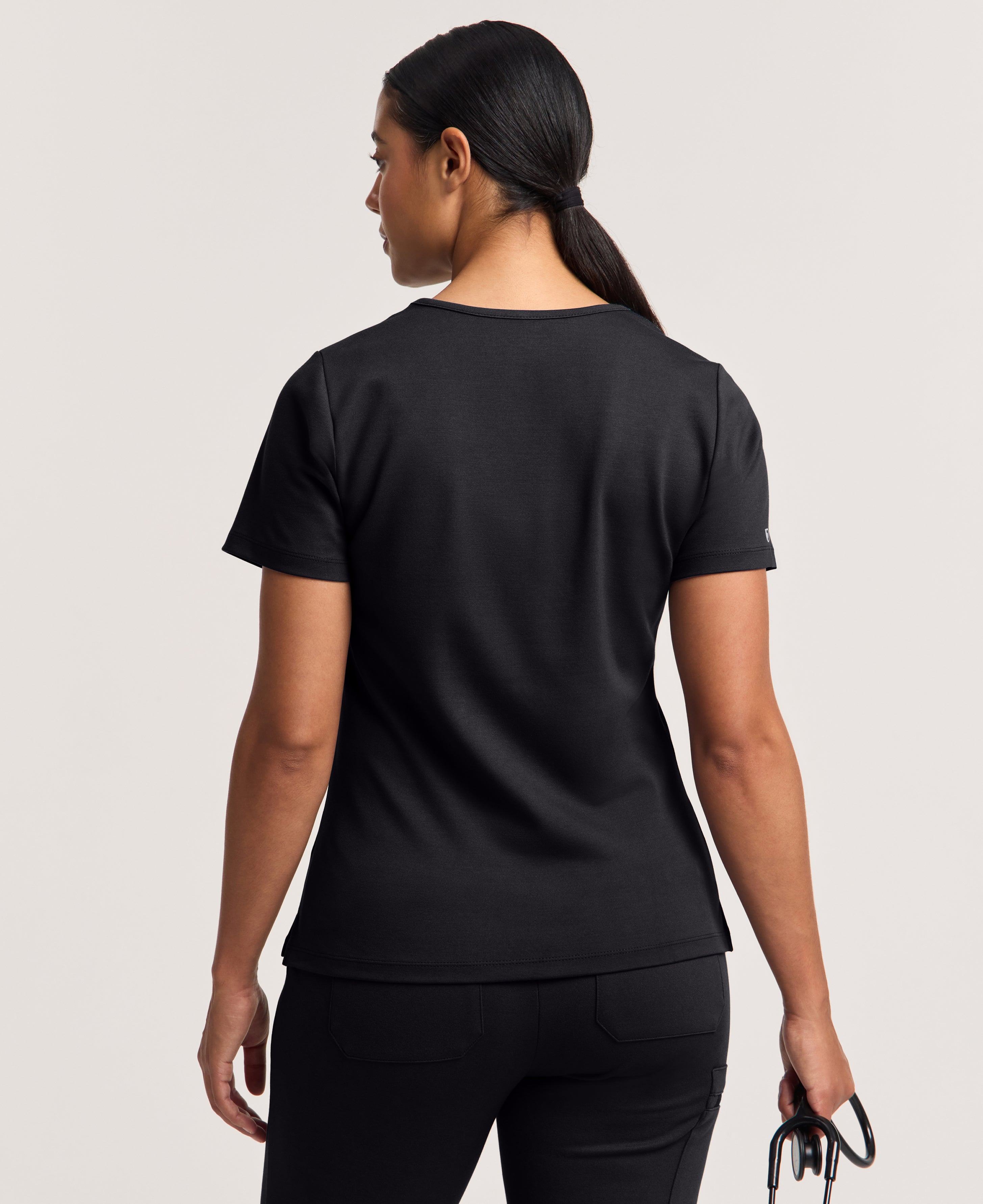 Jaanuu Cesi Slim Scrub Top in Black, product photo 5 of 6