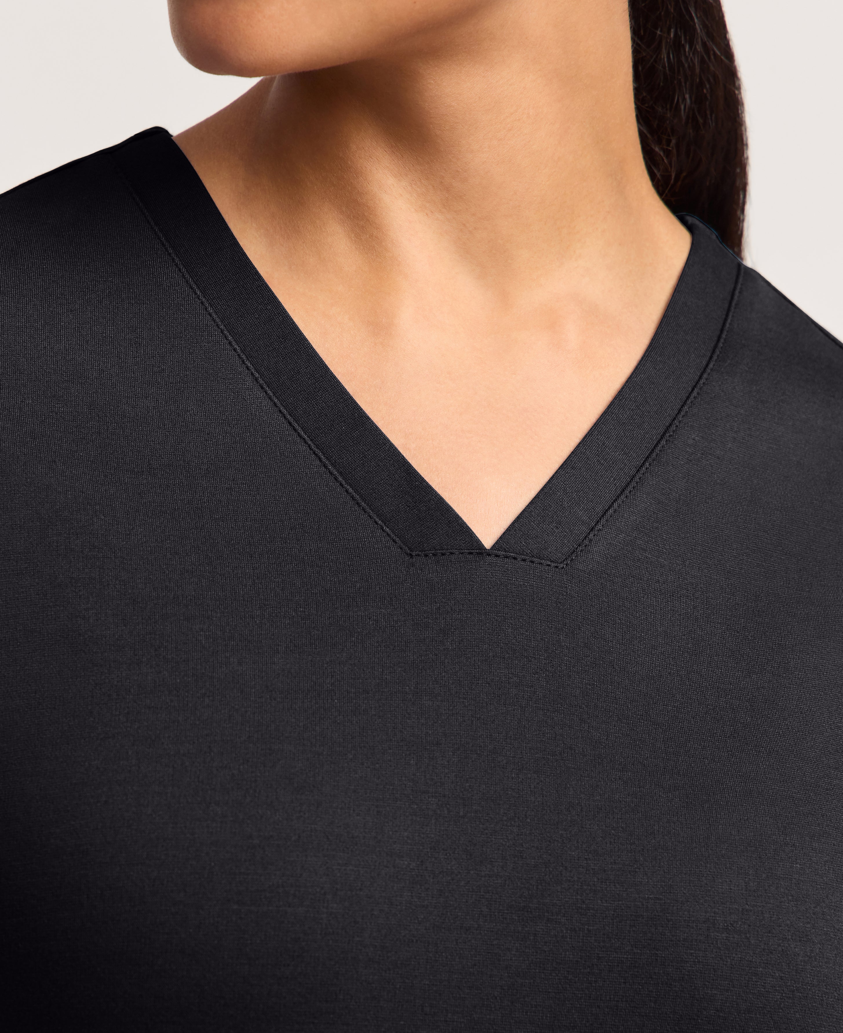 Jaanuu Cesi Slim Scrub Top in Black, product photo 6 of 6