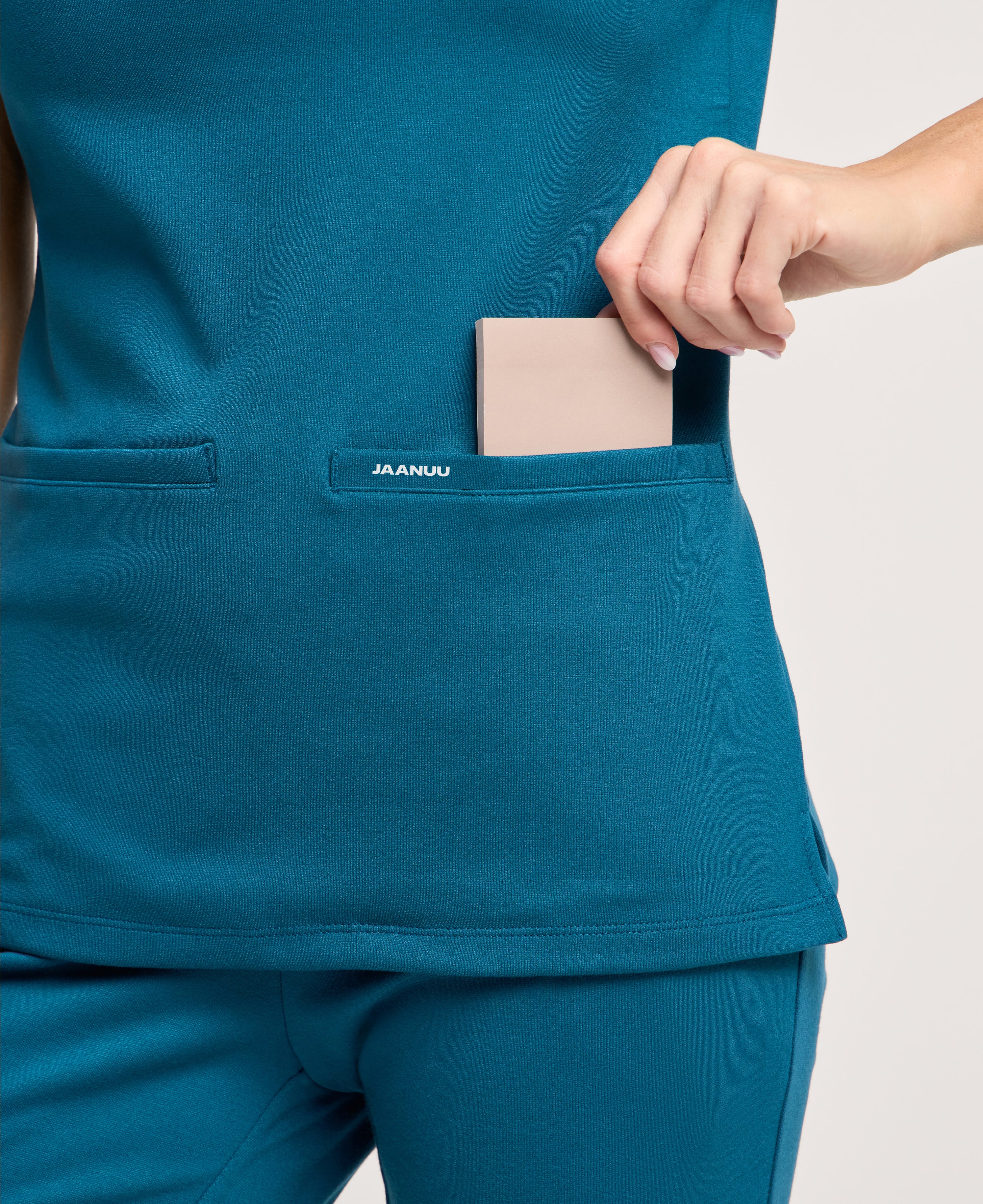 Jaanuu Cesi Slim Scrub Top in Caribbean Blue, product photo 6 of 6