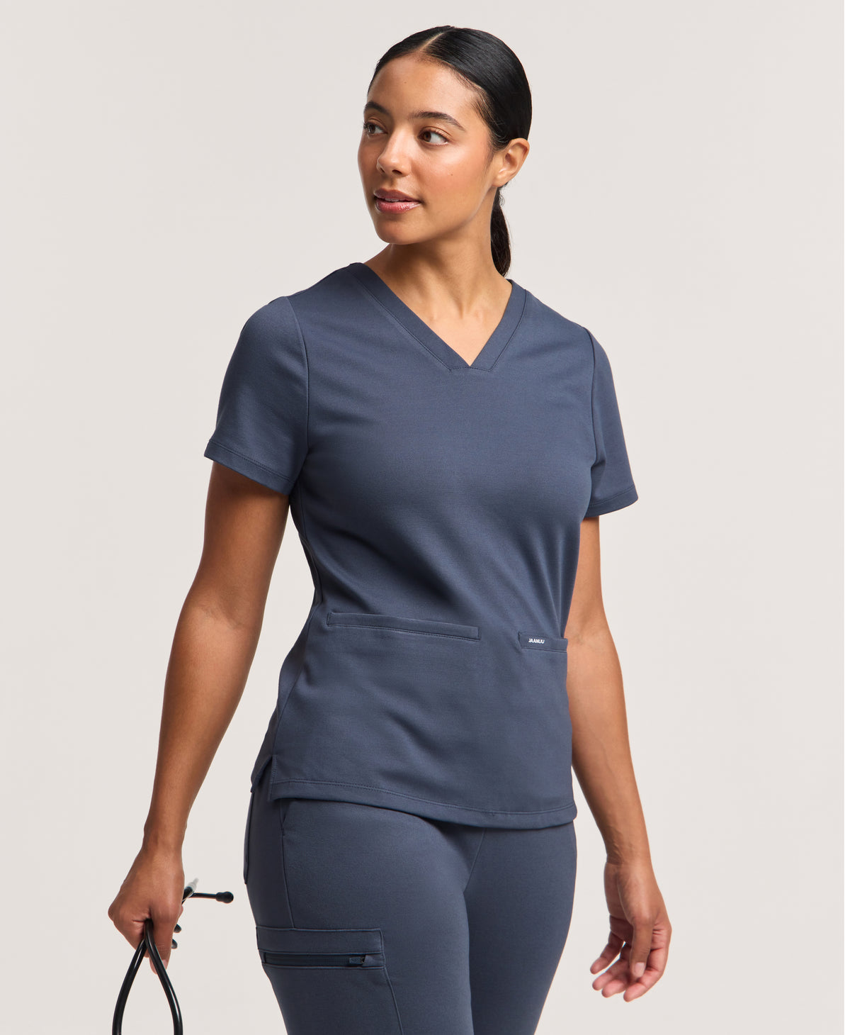 Jaanuu Cesi Slim Scrub Top in Carbon Gray, product photo 1 of 6