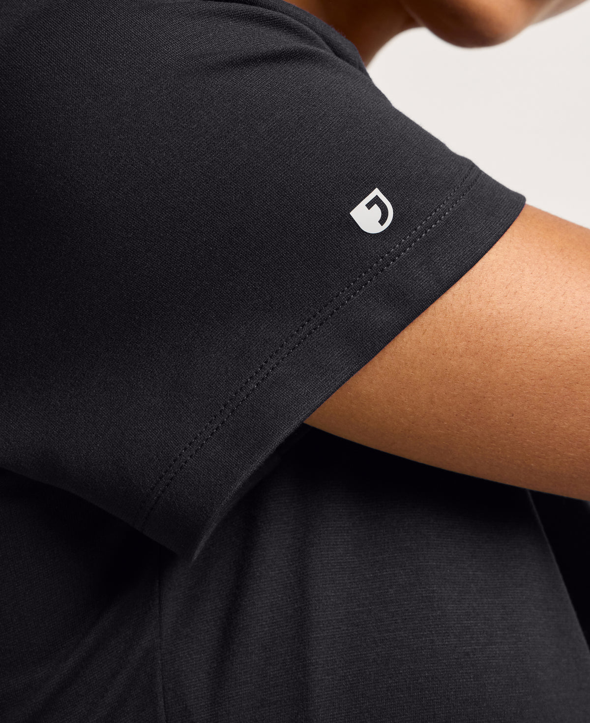 Jaanuu Keva Slim 1-Pocket Scrub Top in Black, product photo 2 of 6