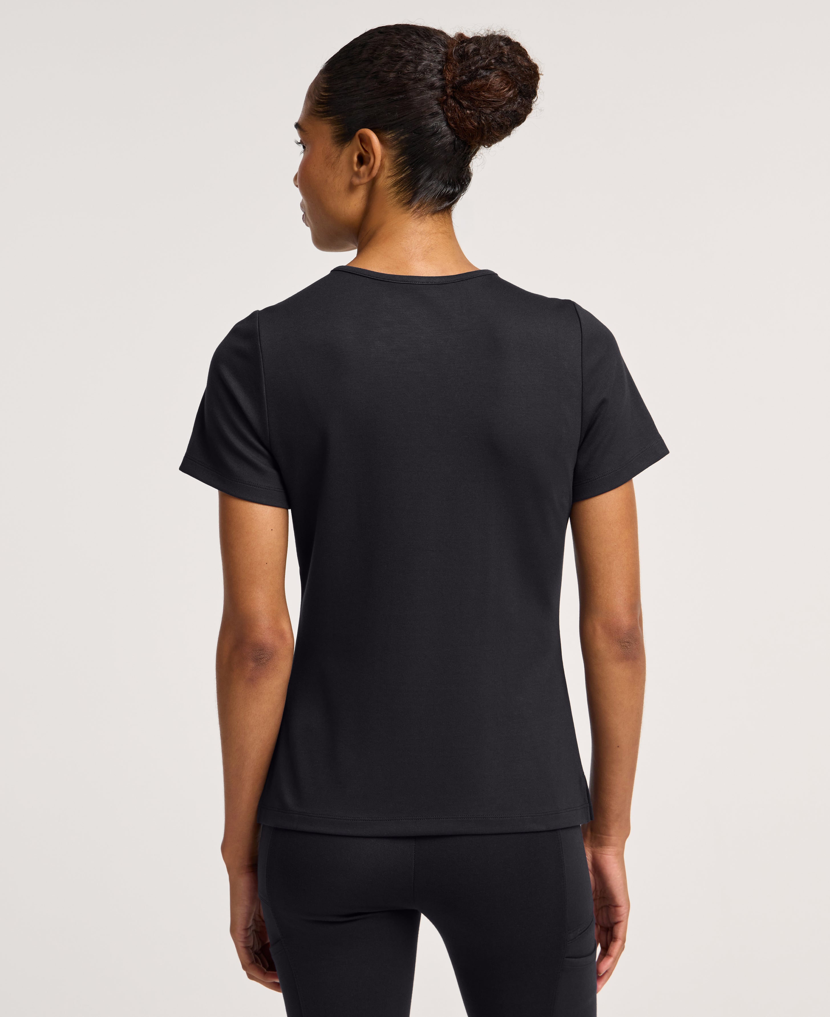 Jaanuu Keva Slim 1-Pocket Scrub Top in Black, product photo 5 of 6