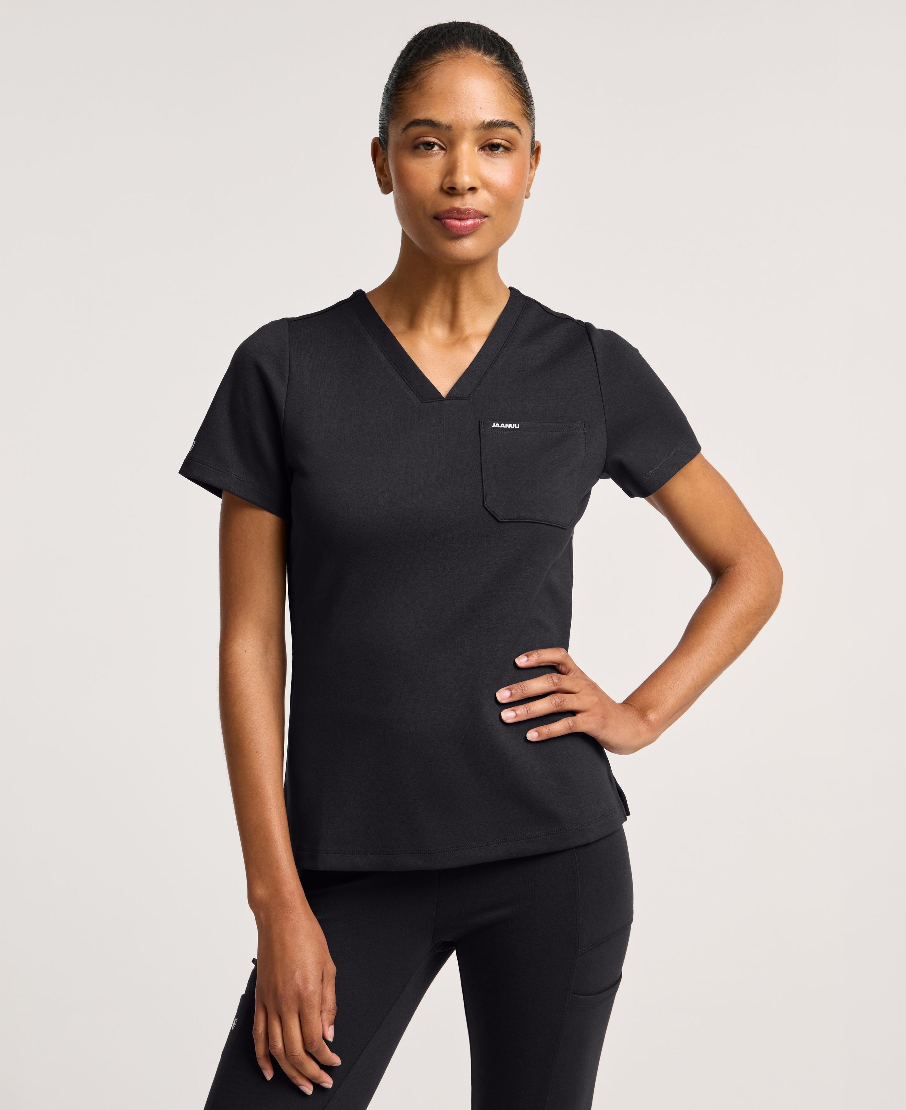 Jaanuu Keva Slim 1-Pocket Scrub Top in Black, product photo 6 of 6