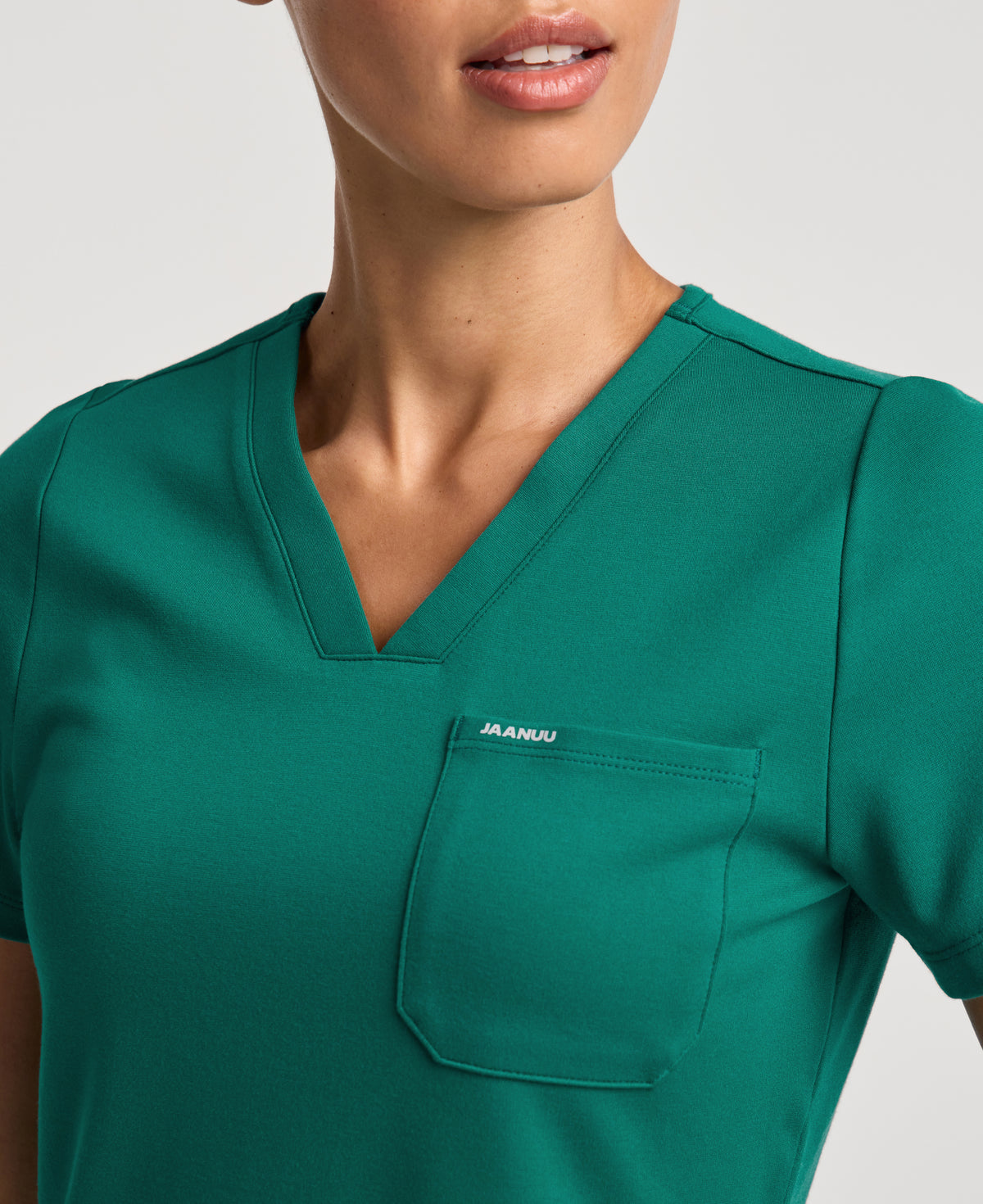 Jaanuu Keva Slim 1-Pocket Scrub Top in Hunter Green, product photo 3 of 6