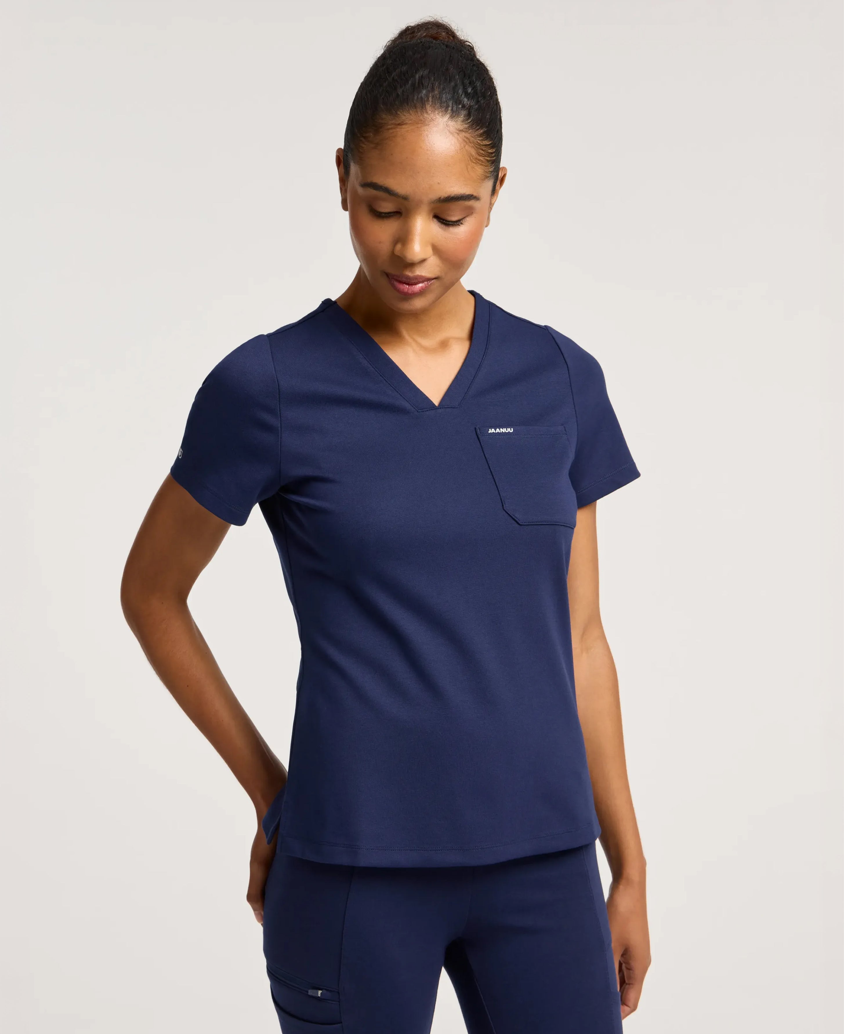 Jaanuu Keva Slim 1-Pocket Scrub Top in Midnight Navy, product photo 1 of 6