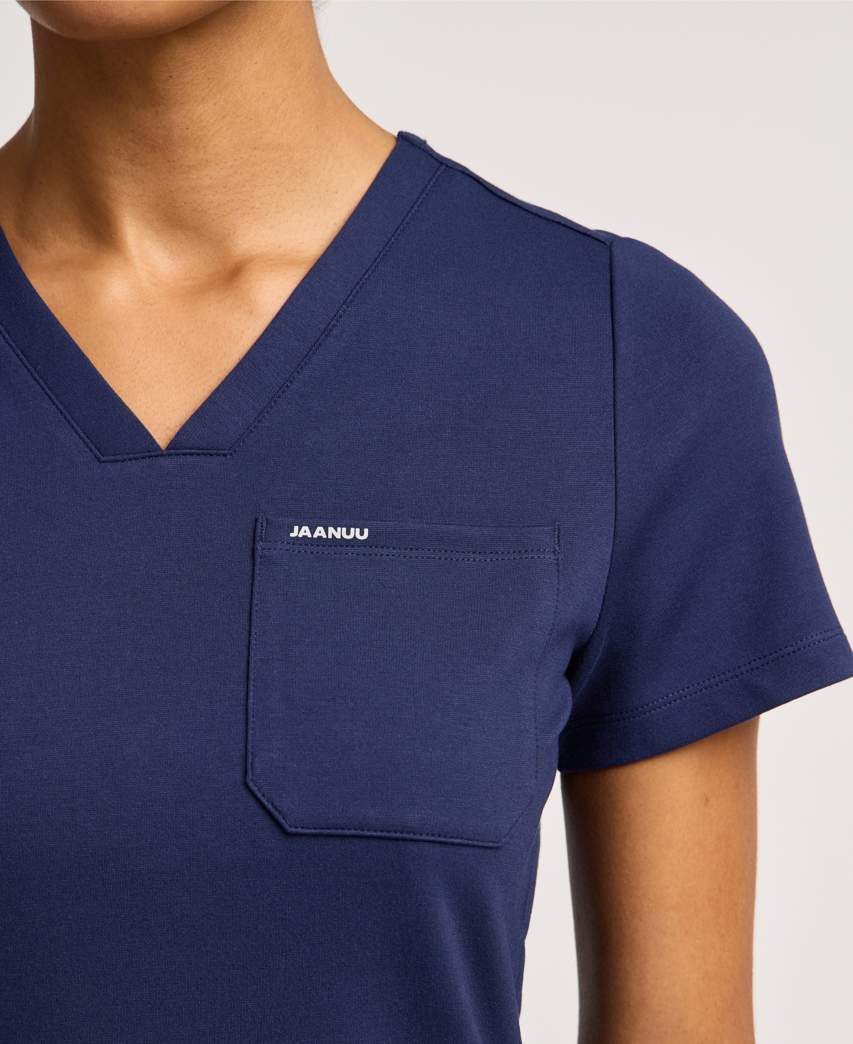 Jaanuu Keva Slim 1-Pocket Scrub Top in Midnight Navy, product photo 3 of 6