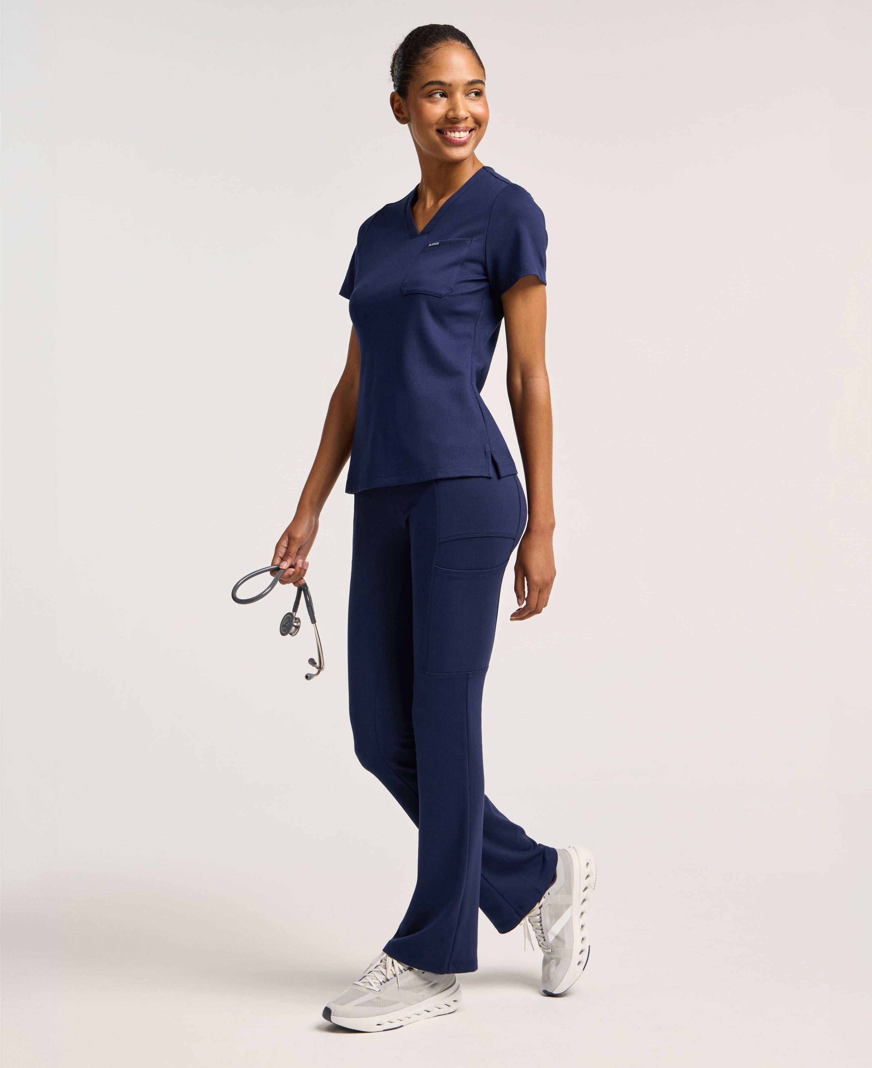 Jaanuu Keva Slim 1-Pocket Scrub Top in Midnight Navy, product photo 4 of 6