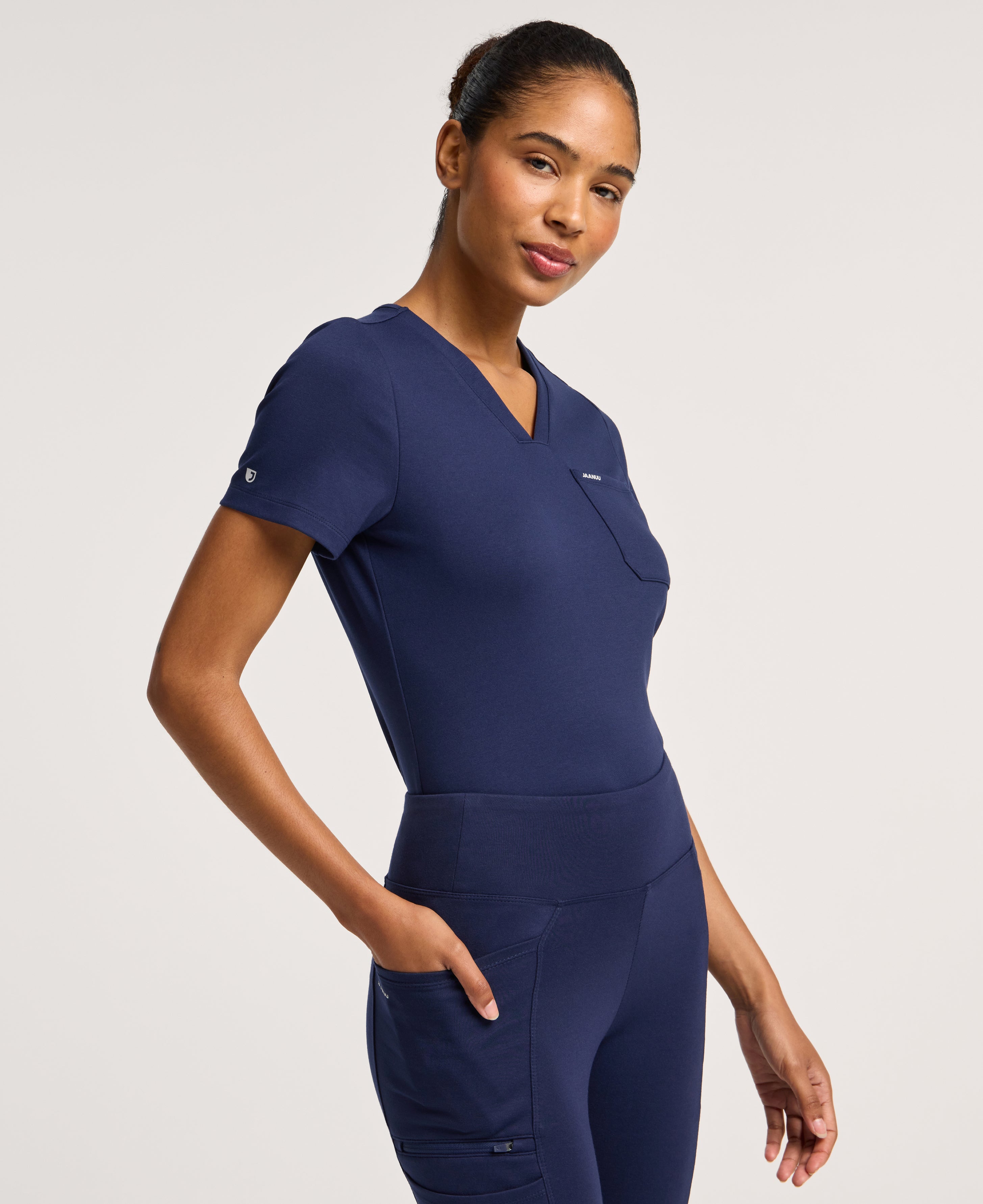 Jaanuu Keva Slim 1-Pocket Scrub Top in Midnight Navy, product photo 5 of 6