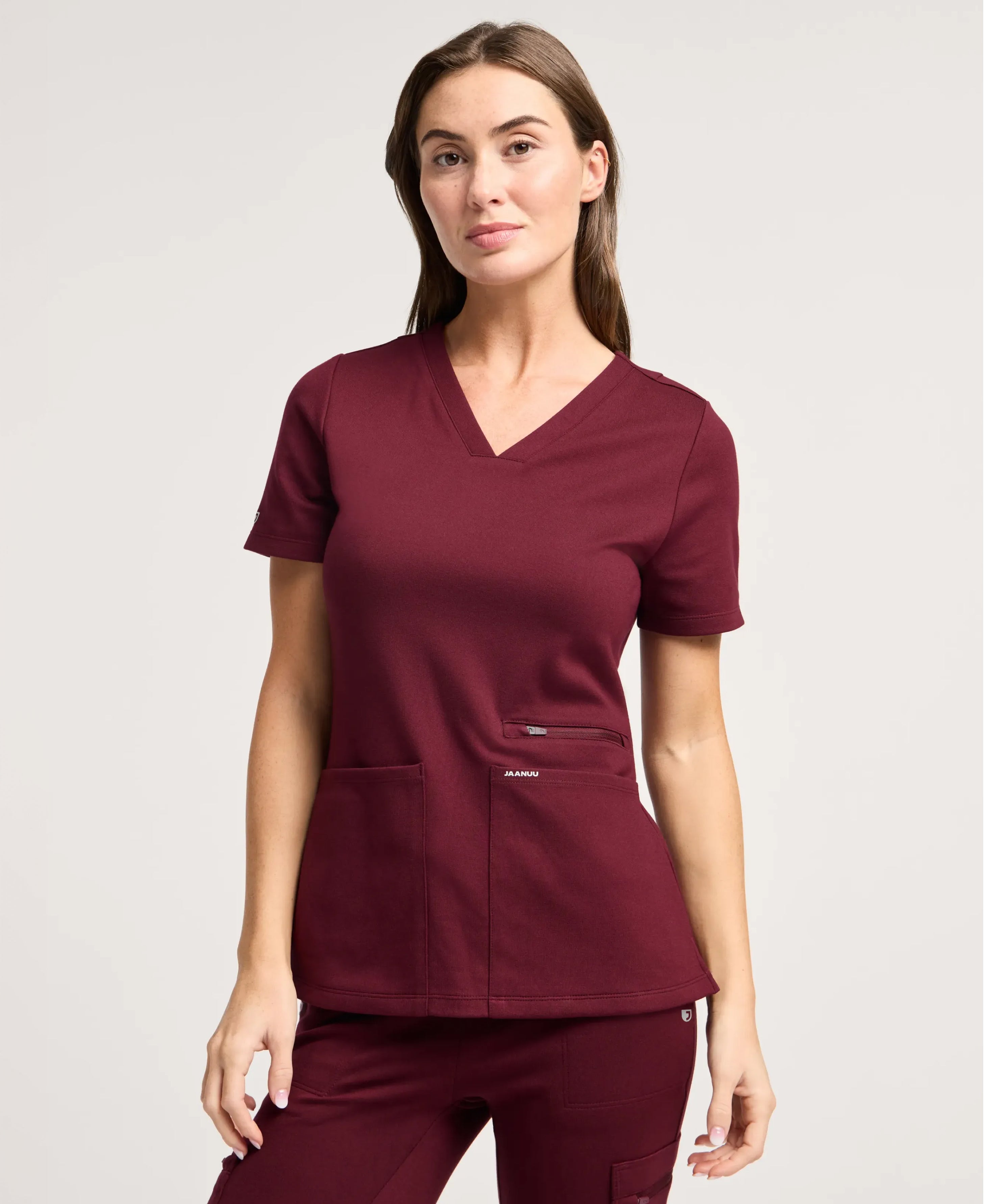Jaanuu Kass Slim 4-Pocket Scrub Top in Burgundy, product photo 1 of 6