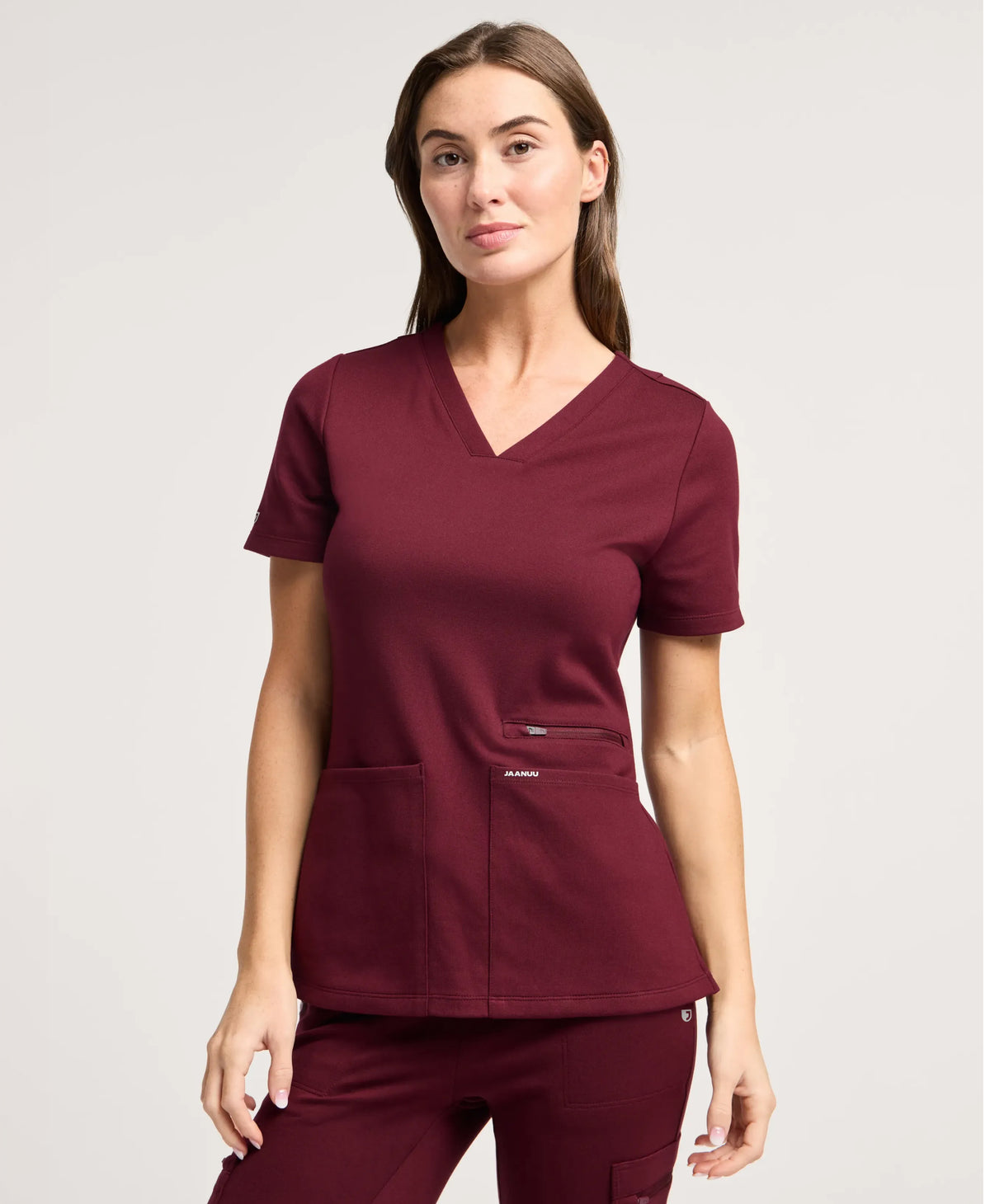 Jaanuu Kass Slim 4-Pocket Scrub Top in Burgundy, product photo 1 of 6