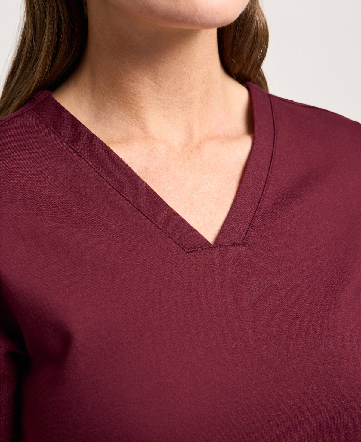 Jaanuu Kass Slim 4-Pocket Scrub Top in Burgundy, product photo 2 of 6