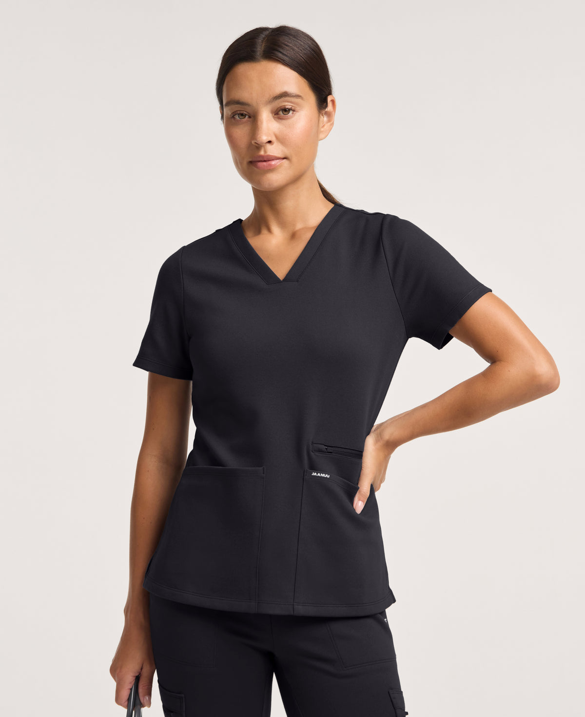 Jaanuu Kass Slim 4-Pocket Scrub Top in Black, product photo 2 of 6