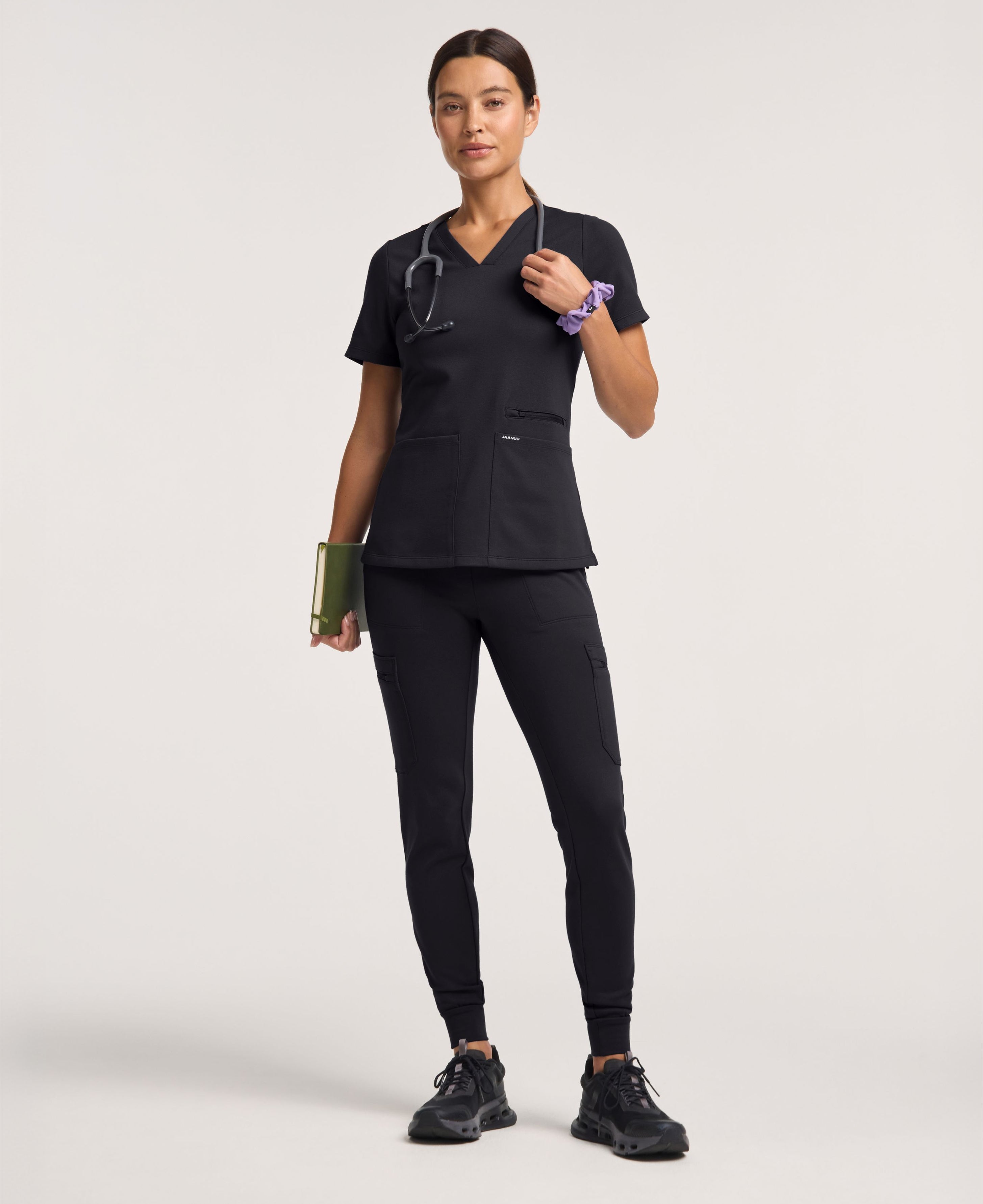 Jaanuu Kass Slim 4-Pocket Scrub Top in Black, product photo 3 of 6