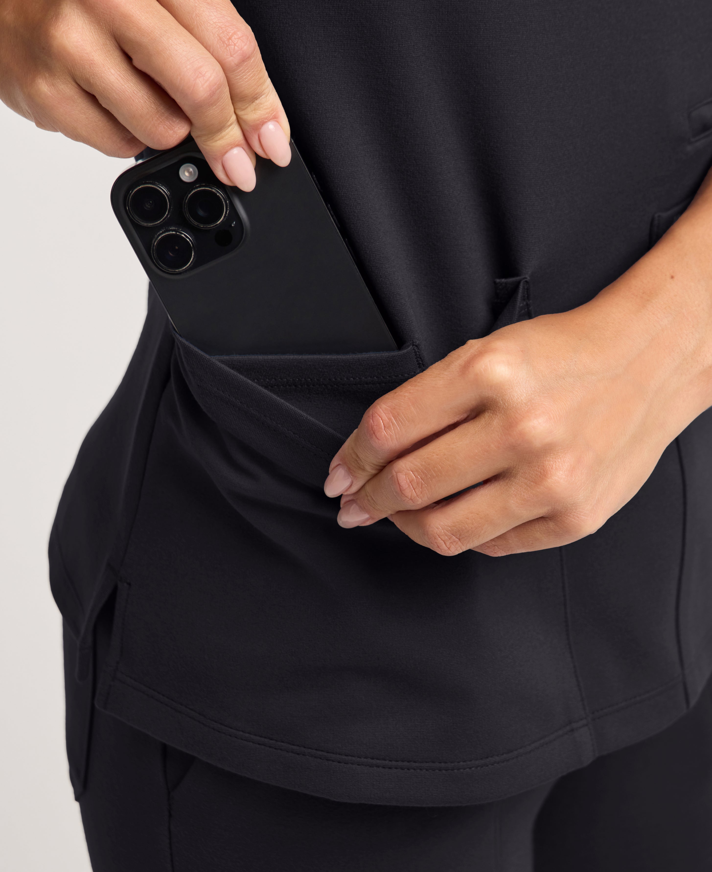 Jaanuu Kass Slim 4-Pocket Scrub Top in Black, product photo 5 of 6