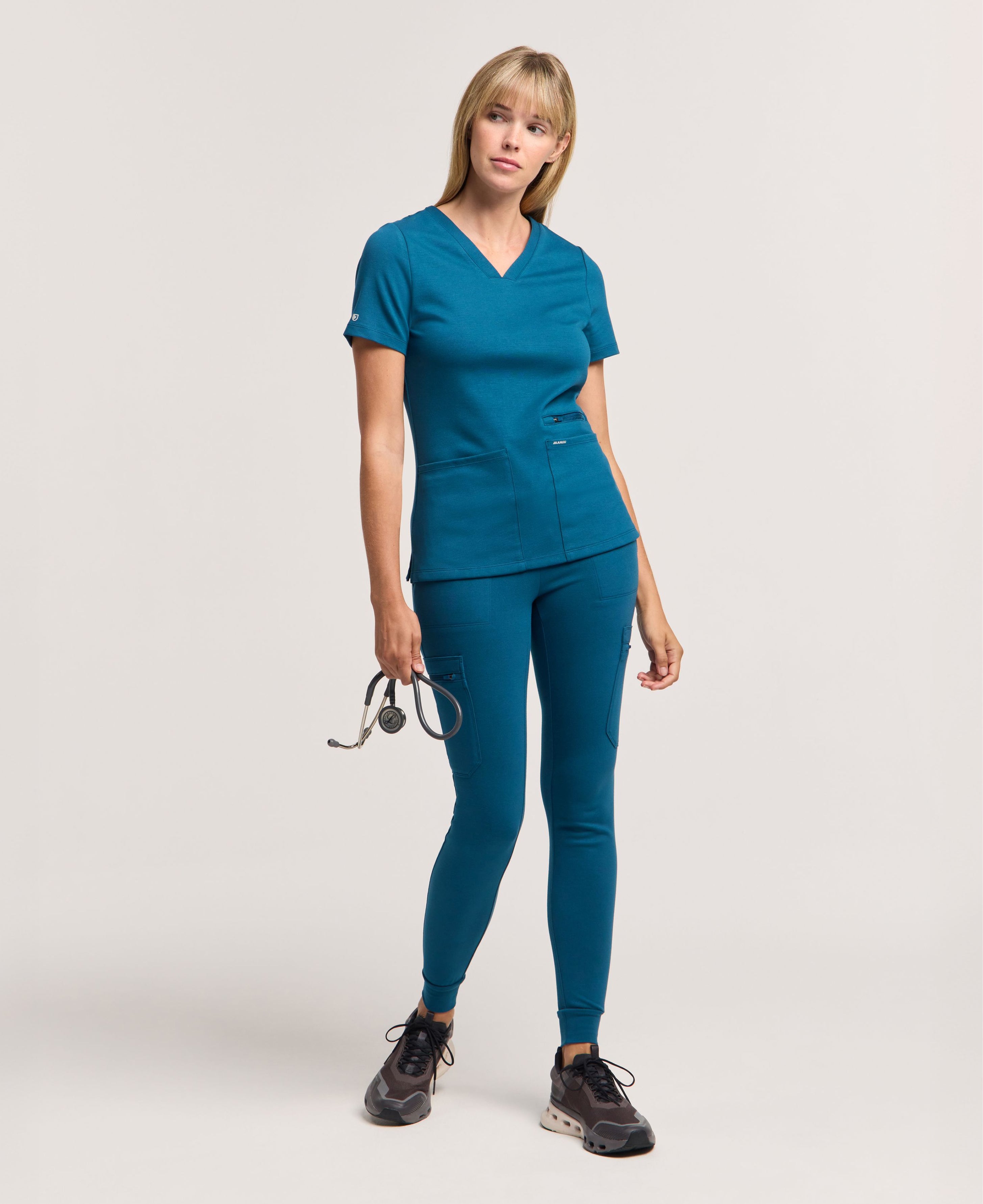 Jaanuu Kass Slim 4-Pocket Scrub Top in Caribbean Blue, product photo 4 of 6