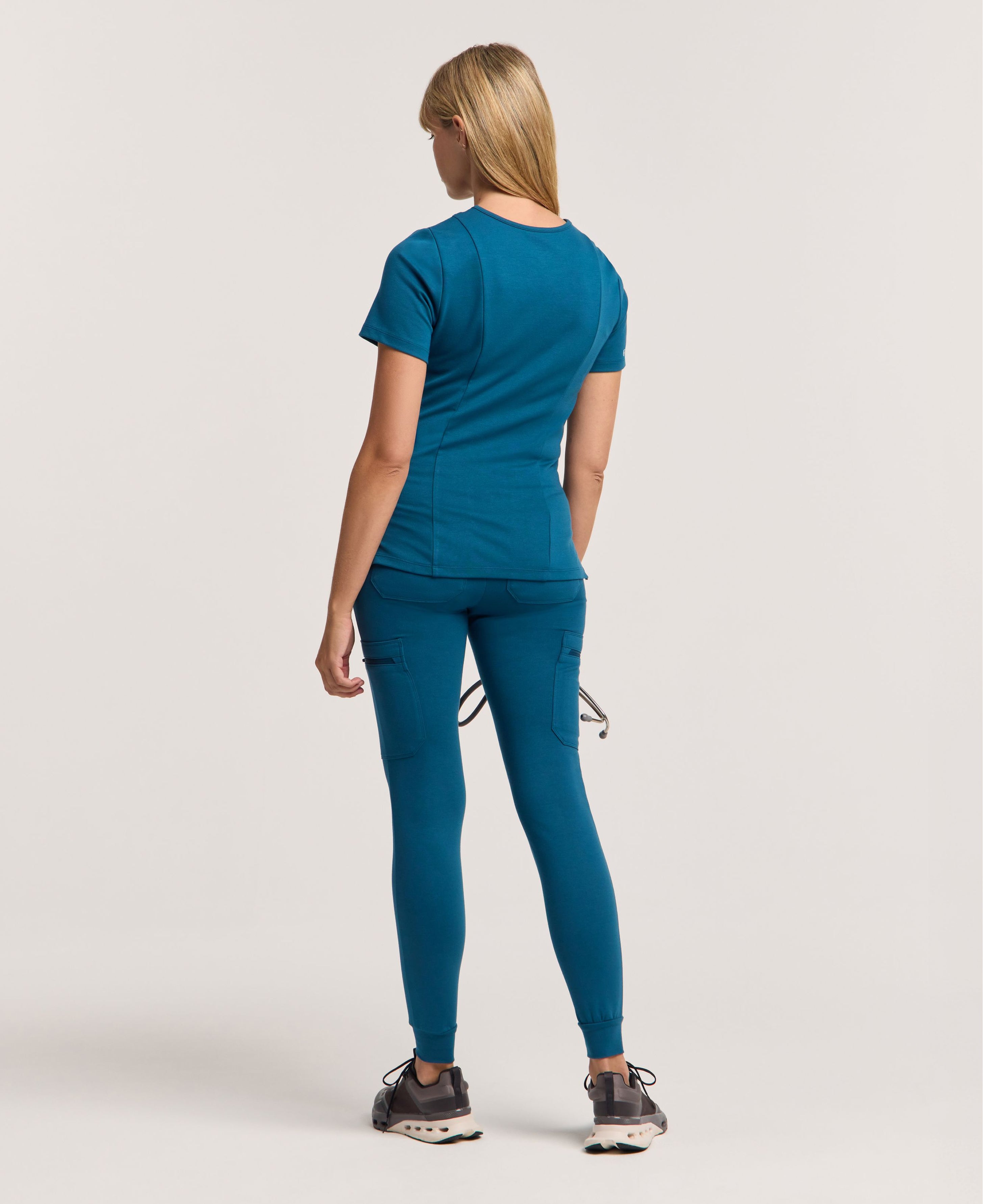 Jaanuu Kass Slim 4-Pocket Scrub Top in Caribbean Blue, product photo 5 of 6