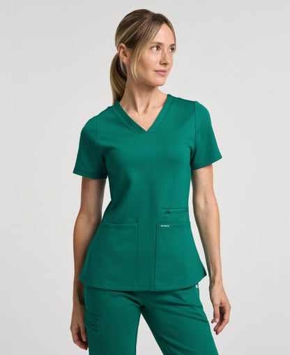 Jaanuu Kass Slim 4-Pocket Scrub Top in Hunter Green, product photo 1 of 6