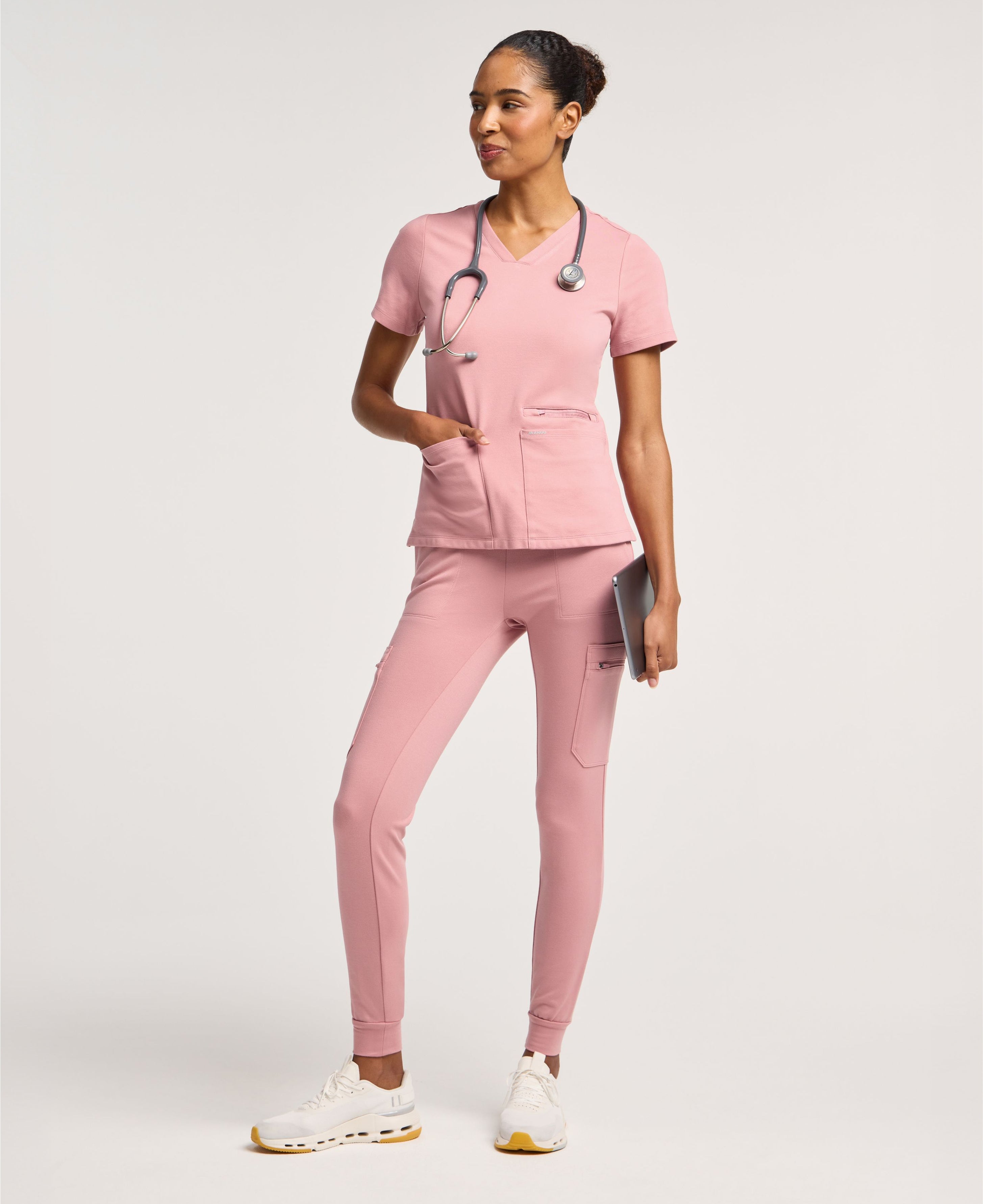 Jaanuu Kass Slim 4-Pocket Scrub Top in Mauve, product photo 1 of 6