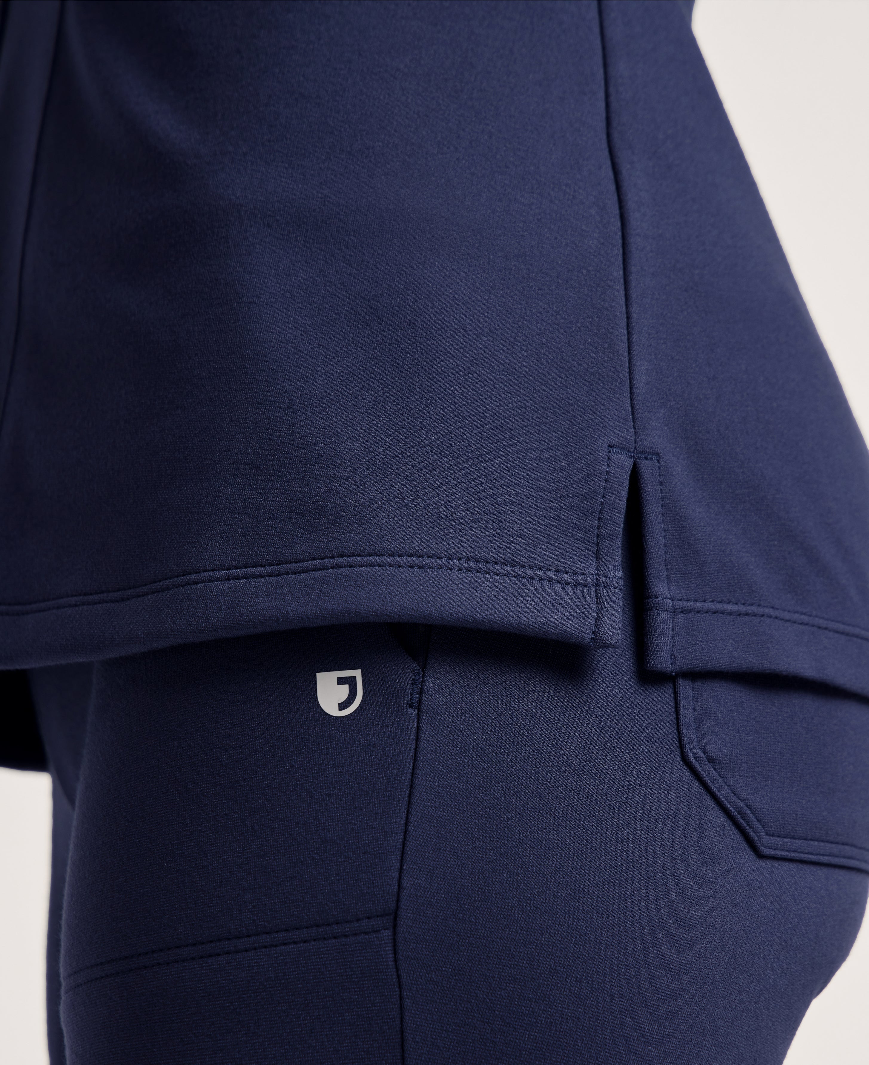 Jaanuu Kass Slim 4-Pocket Scrub Top in Midnight Navy, product photo 3 of 6