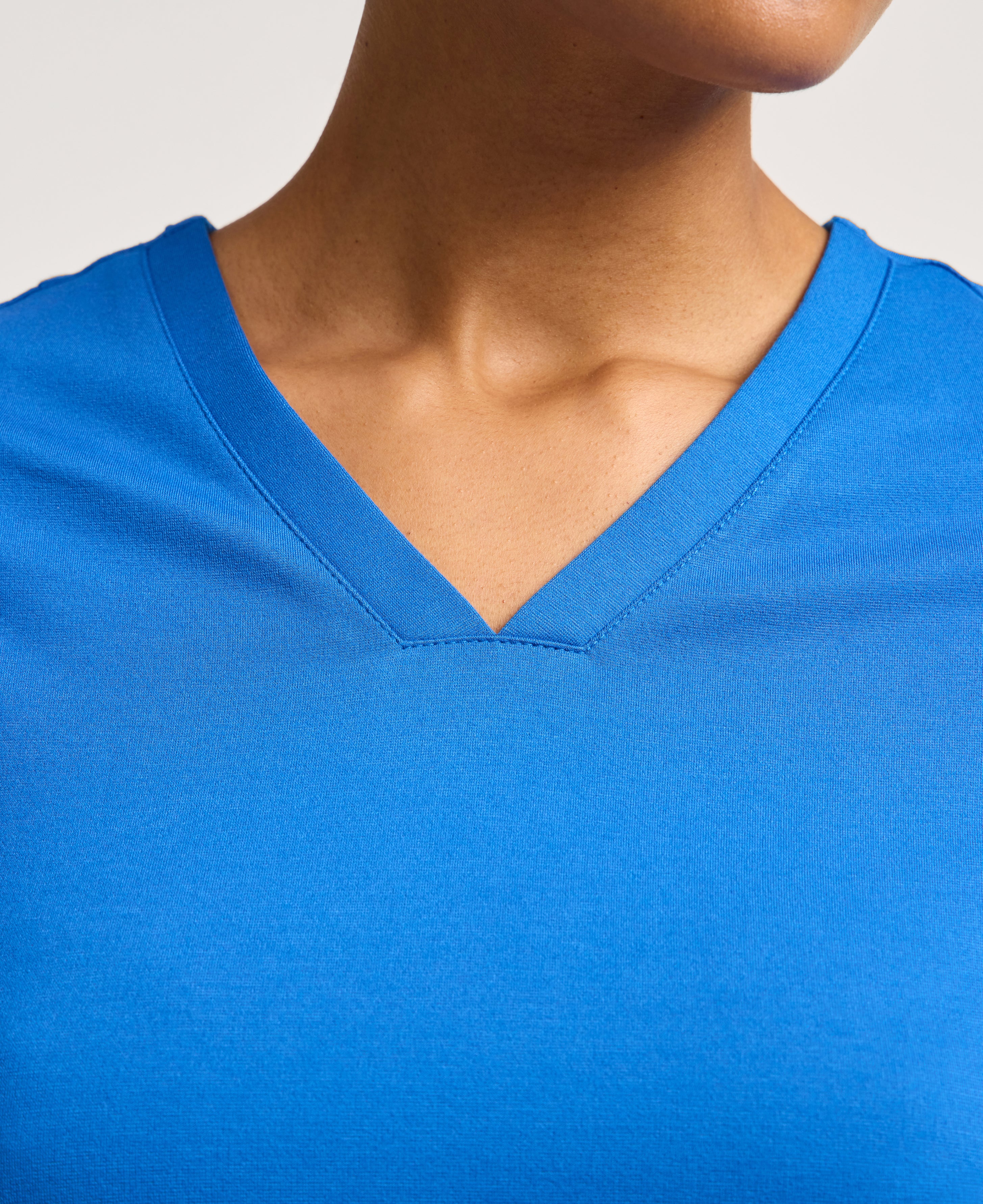 Jaanuu Kass Slim 4-Pocket Scrub Top in Royal Blue, product photo 2 of 6