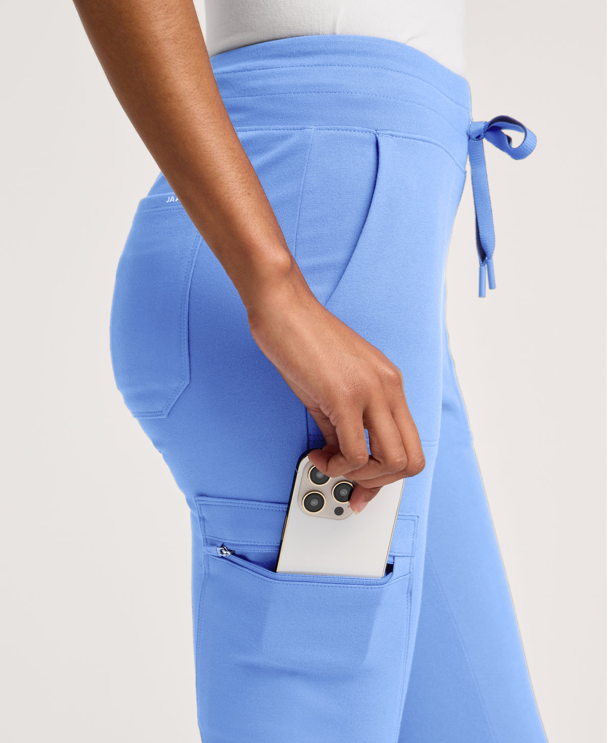 Jaanuu Kait 10-Pocket Skinny Scrub Jogger in Ceil Blue, product photo 1 of 6