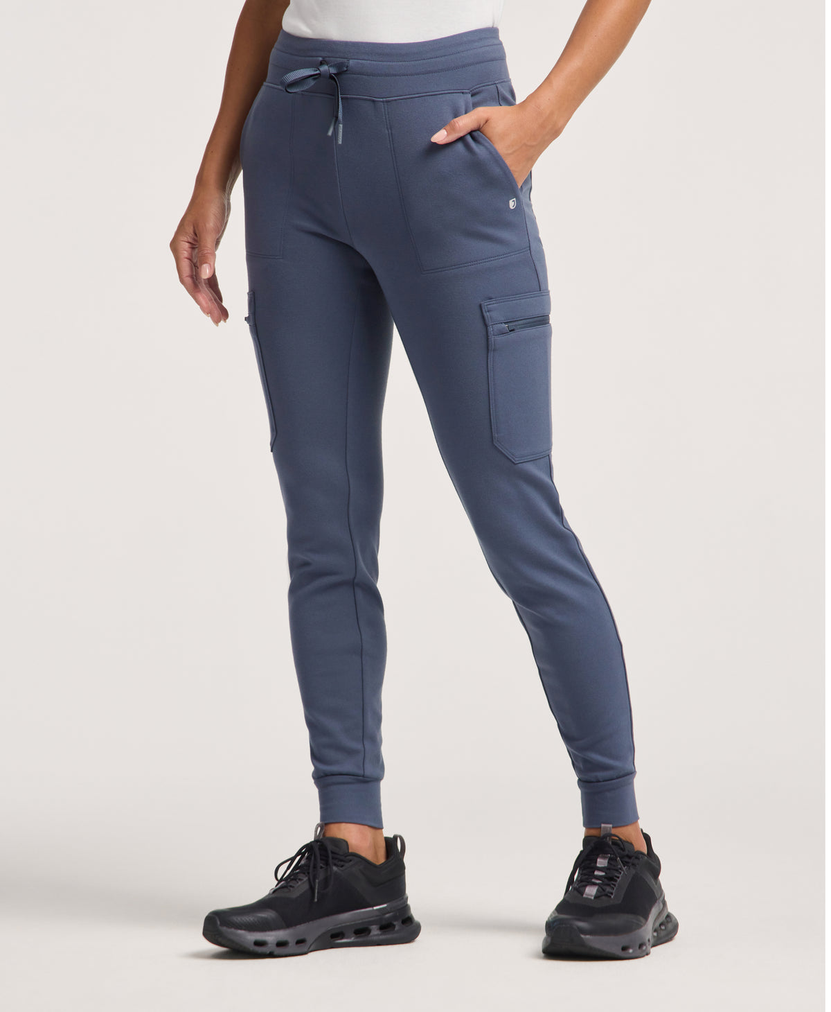 Jaanuu Kait 10-Pocket Skinny Scrub Jogger in Carbon Gray, product photo 1 of 6