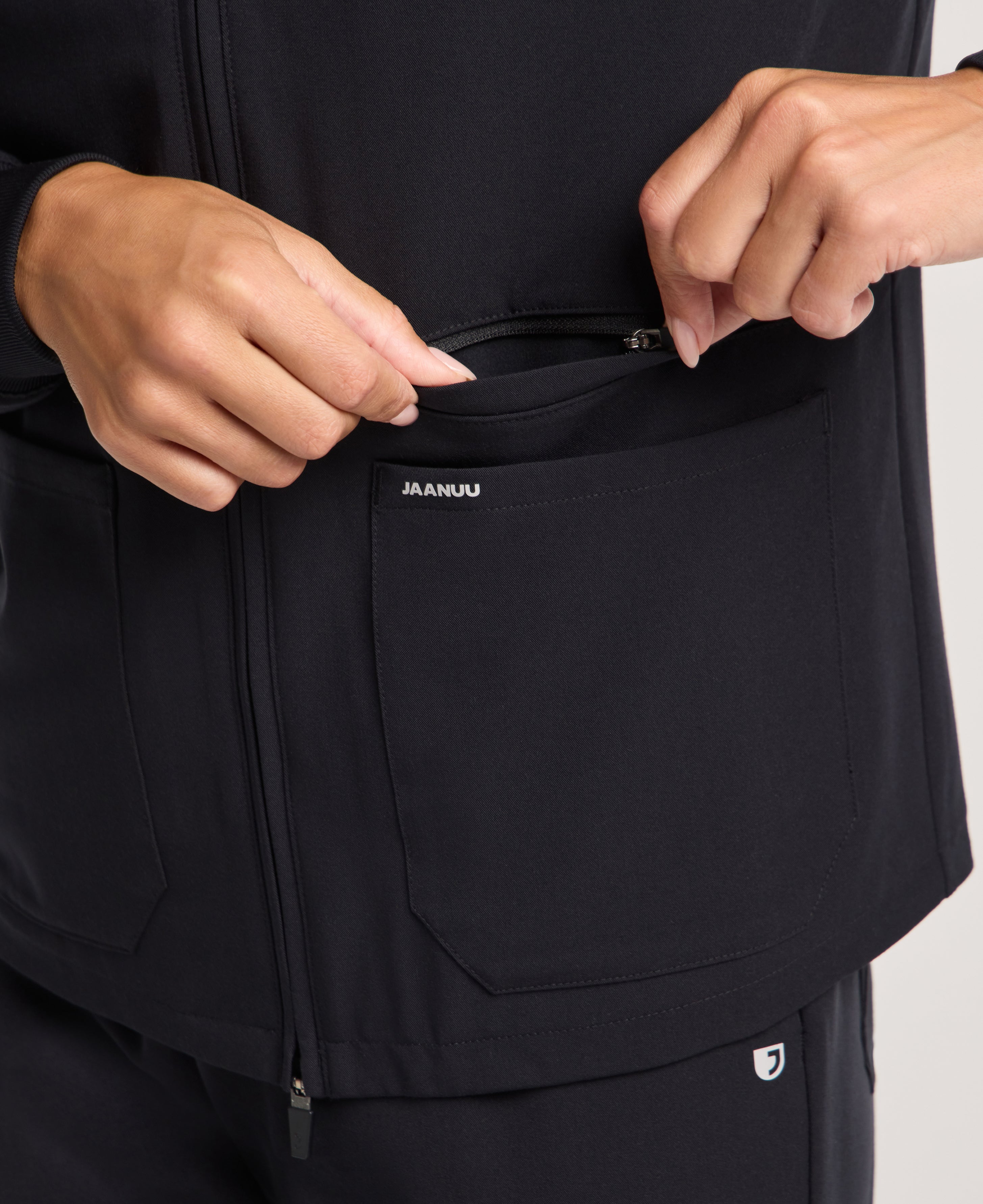 Jaanuu Ceri 6-Pocket Scrub Jacket in Black, product photo 5 of 6