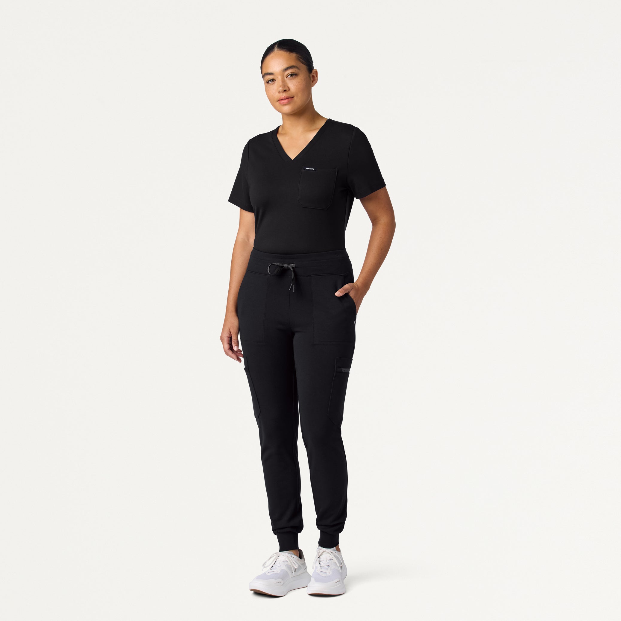 Woman wearing a Black scrub top and scrub pant