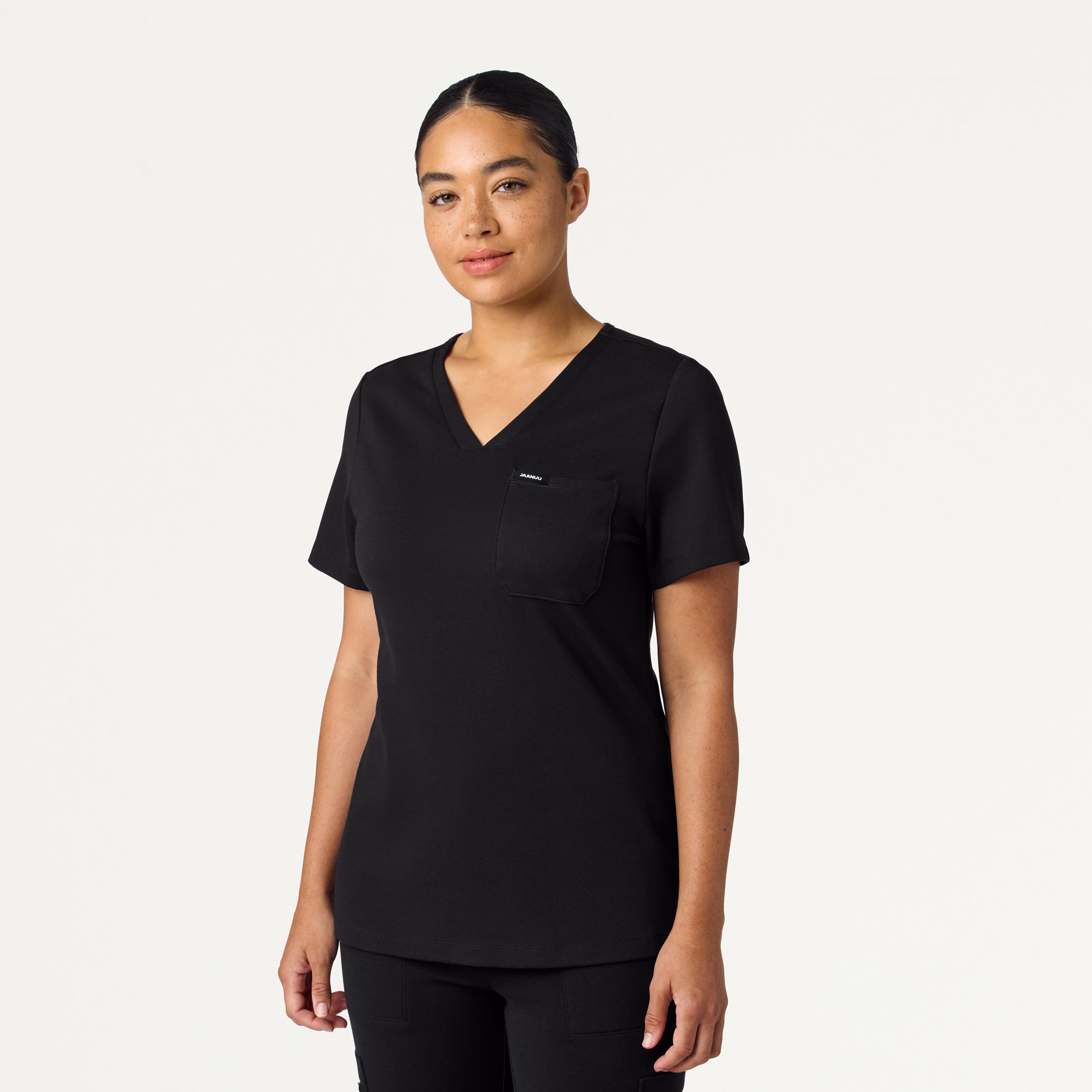Woman wearing a Black scrub top