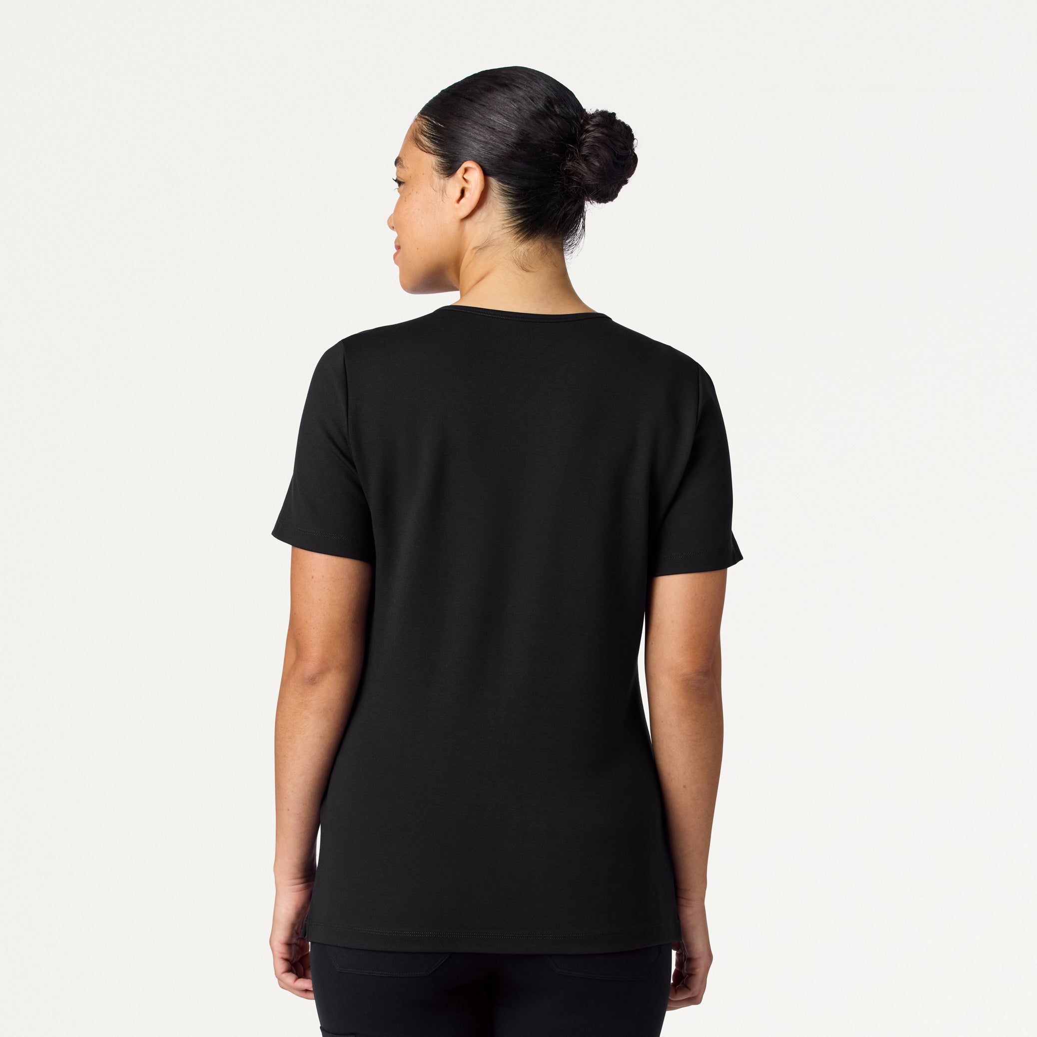 Woman wearing a Black scrub top