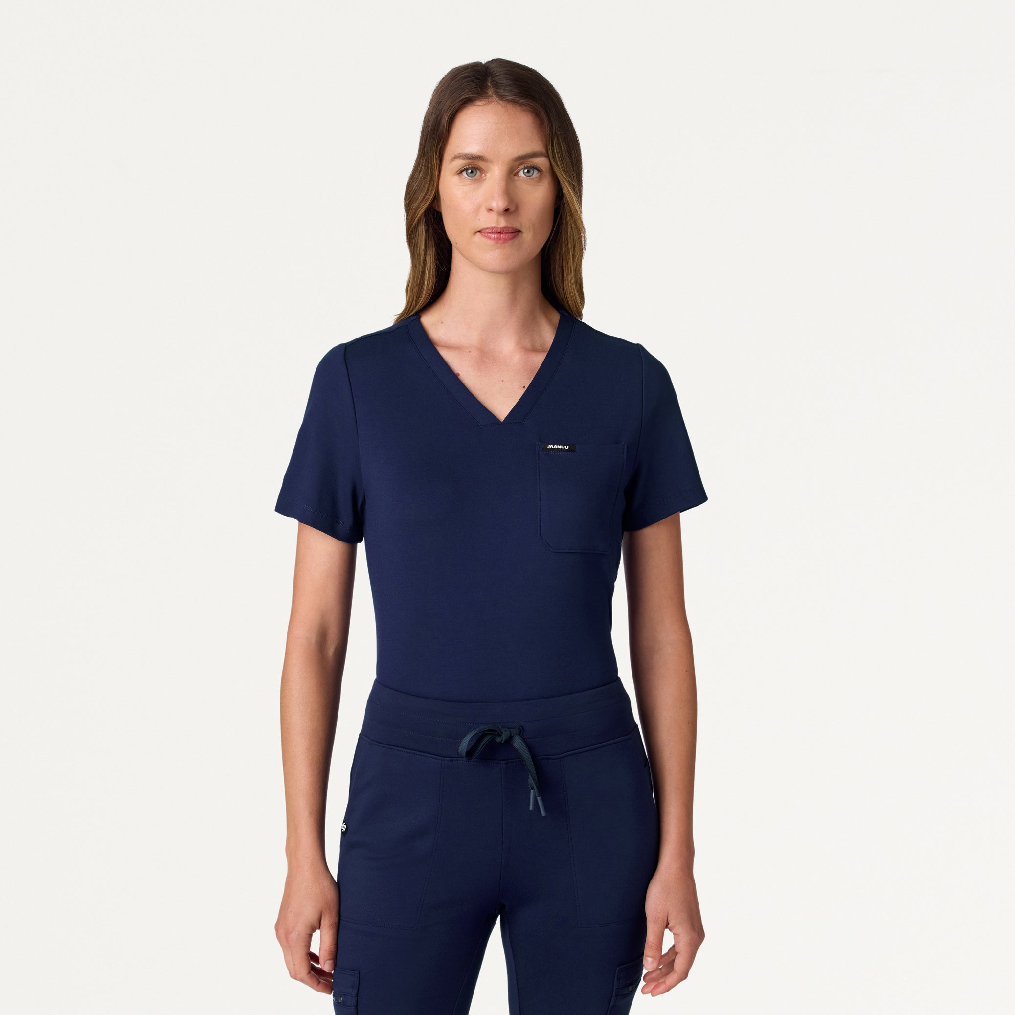 Woman wearing a Midnight Navy scrub top