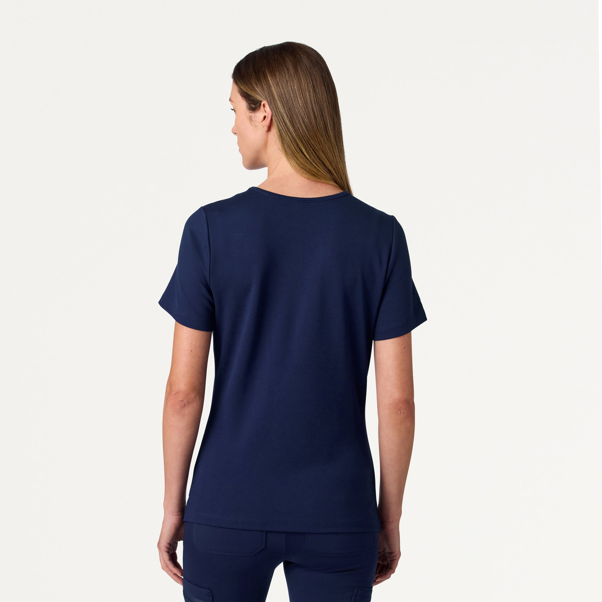 Woman wearing a Midnight Navy scrub top