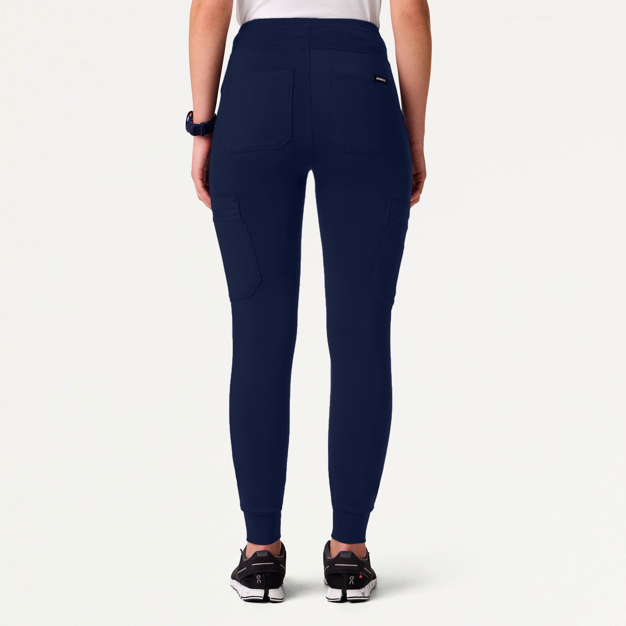 Woman wearing a Midnight Navy scrub pant