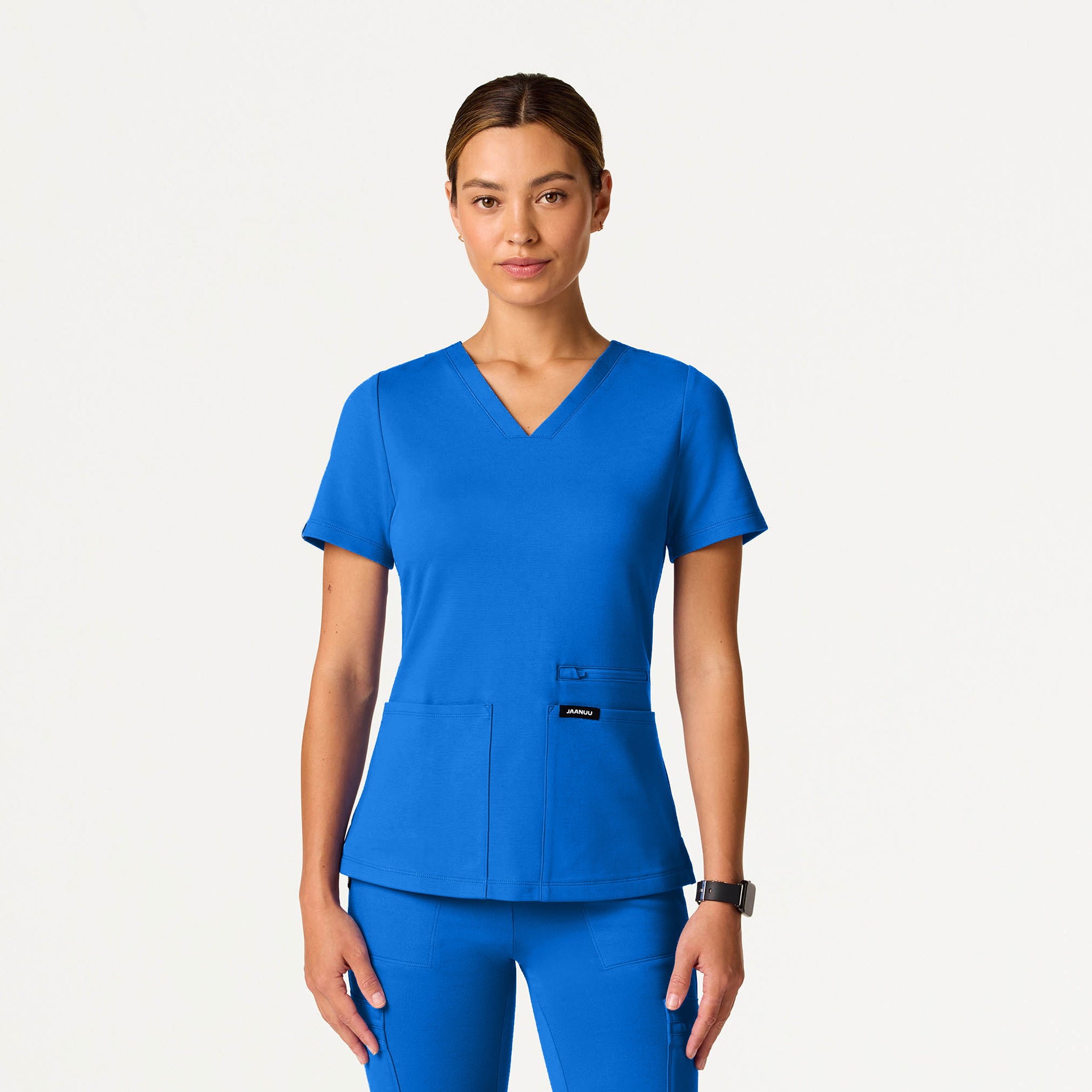 Person wearing a Royal Blue scrub set on a white background