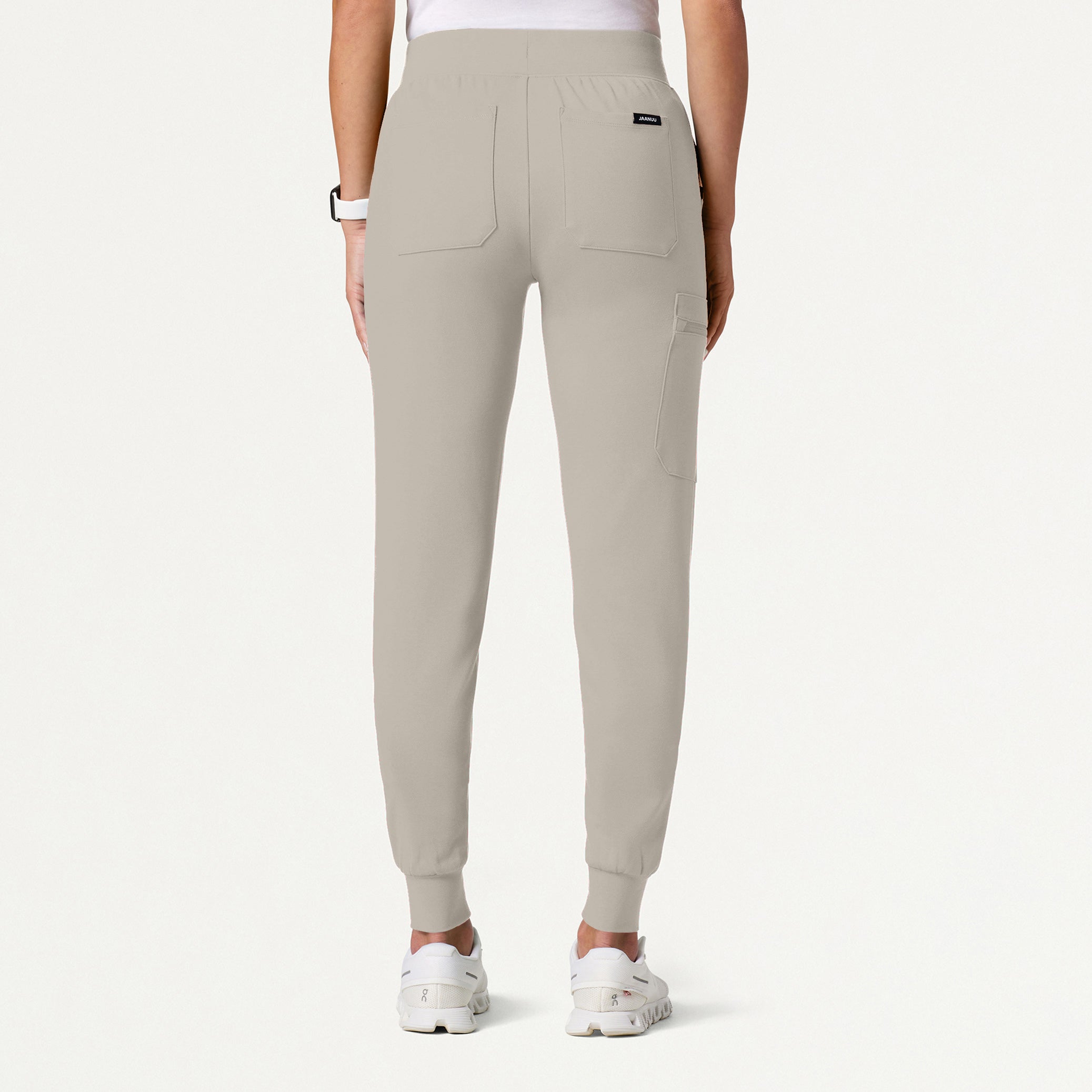 Woman wearing Fog color scrub pant.