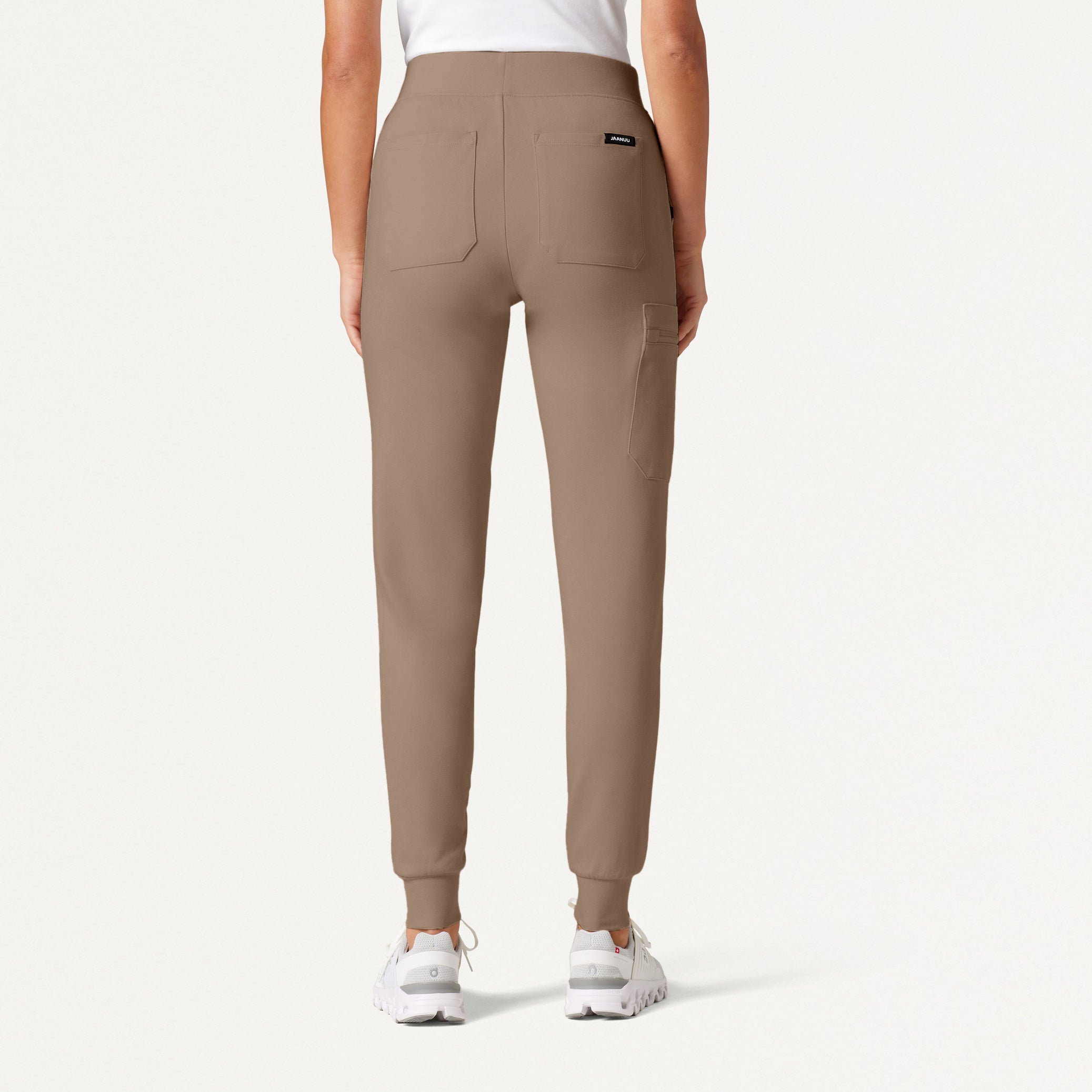 Woman wearing a Mocha scrub pant