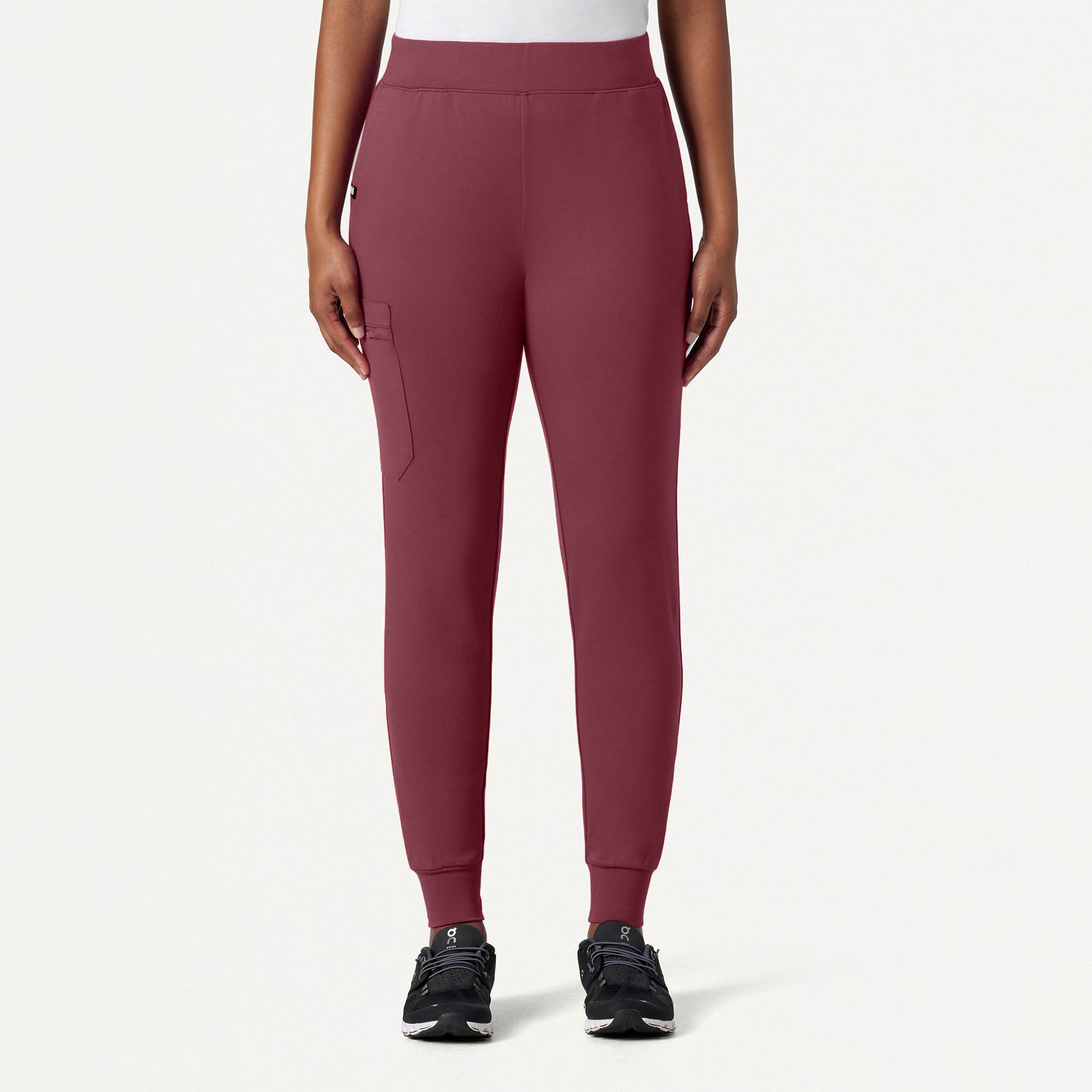 Rosewood jogger pants worn by a person on a white background