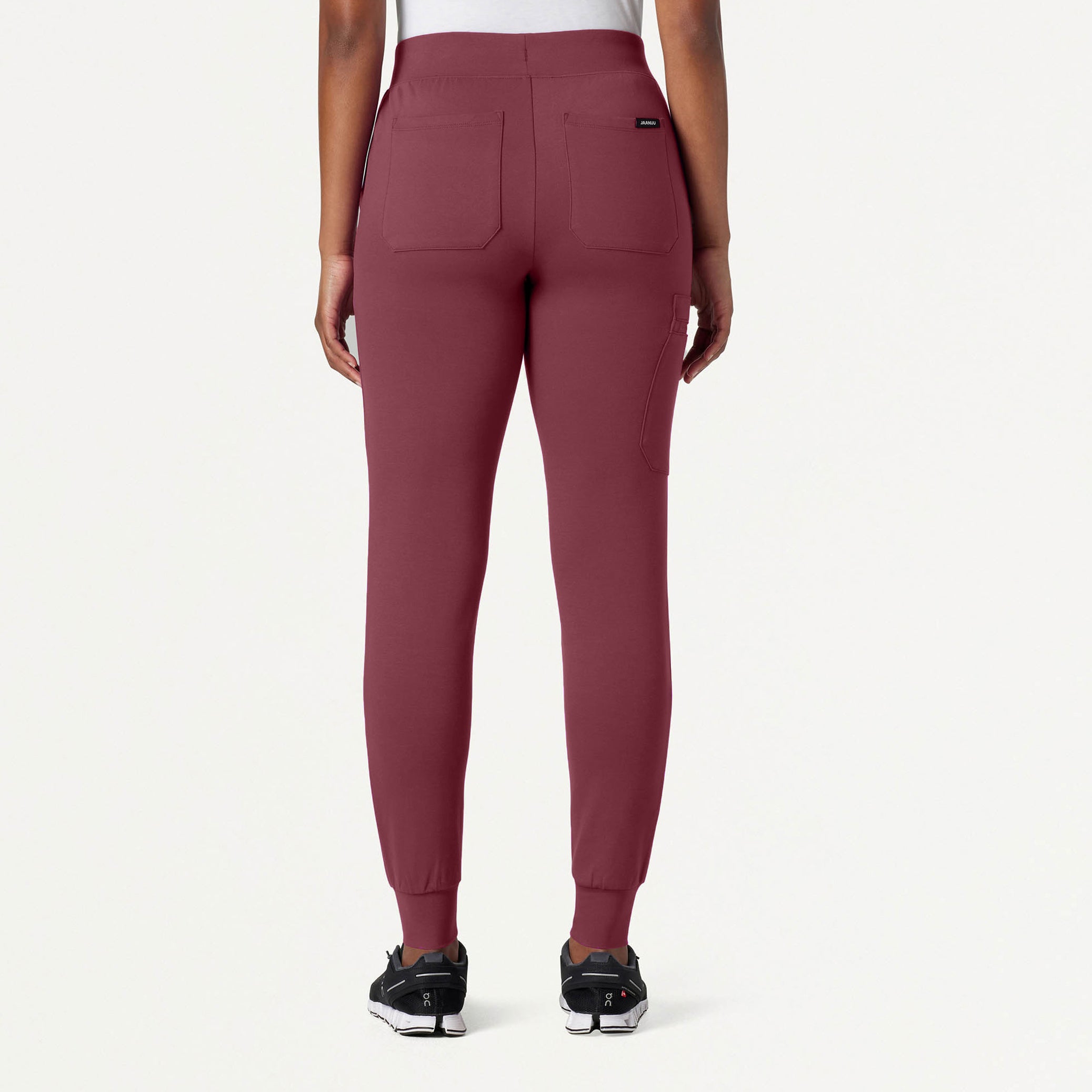 Rosewood jogger pants worn by a person on a white background