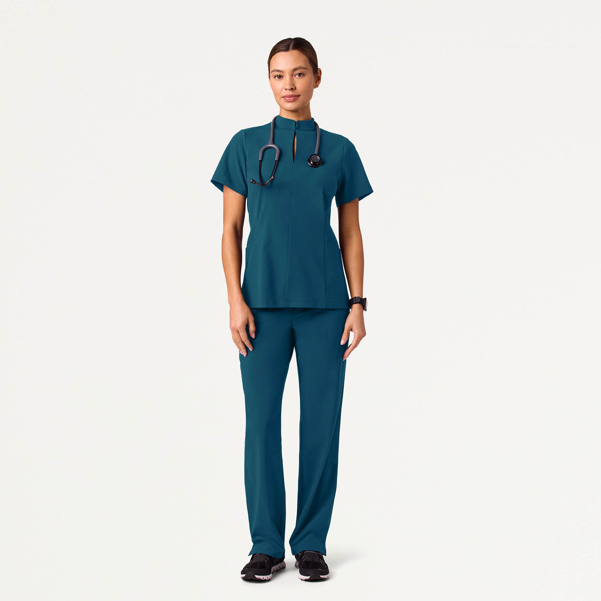 Woman wearing Caribbean Blue scrubs