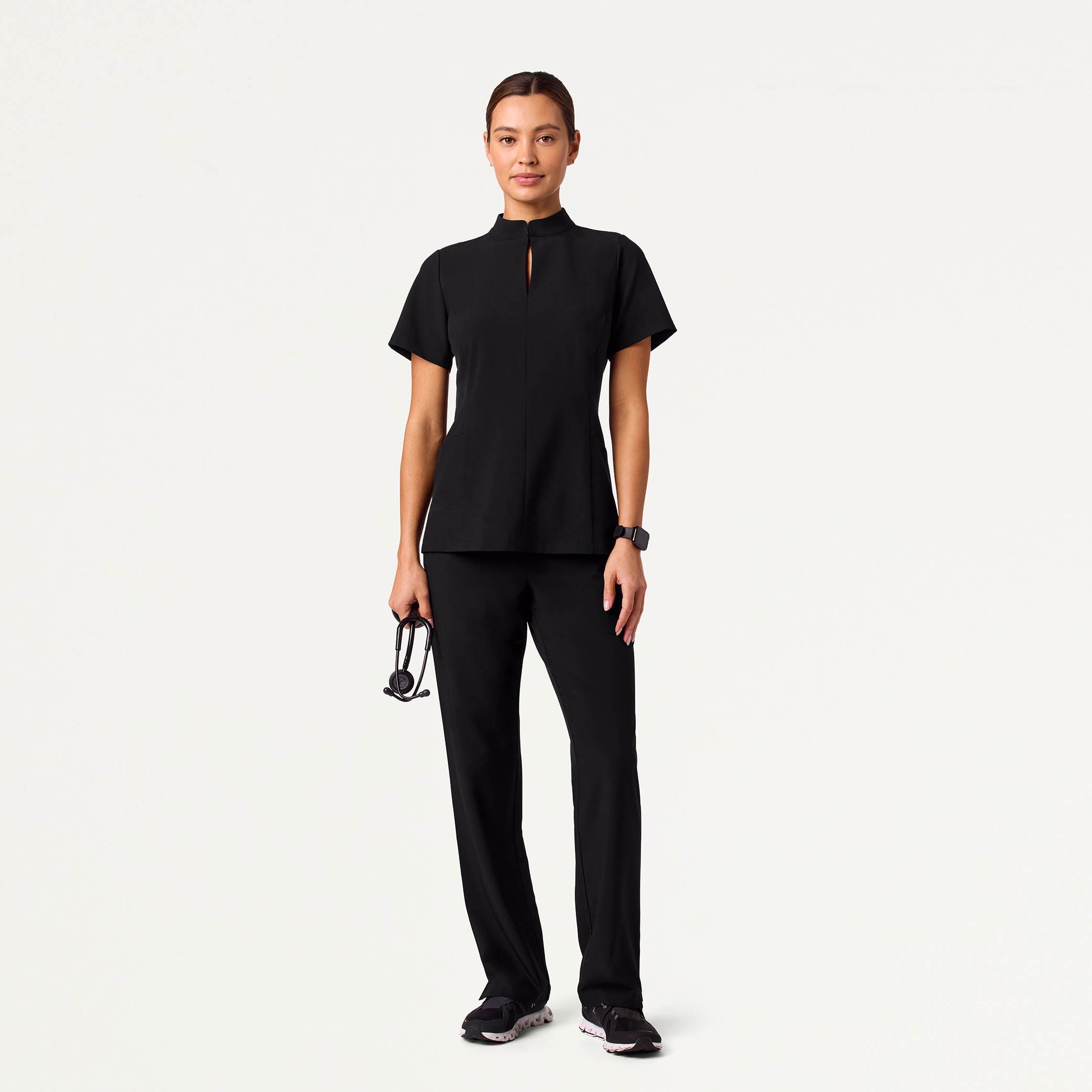 Woman wearing black scrubs