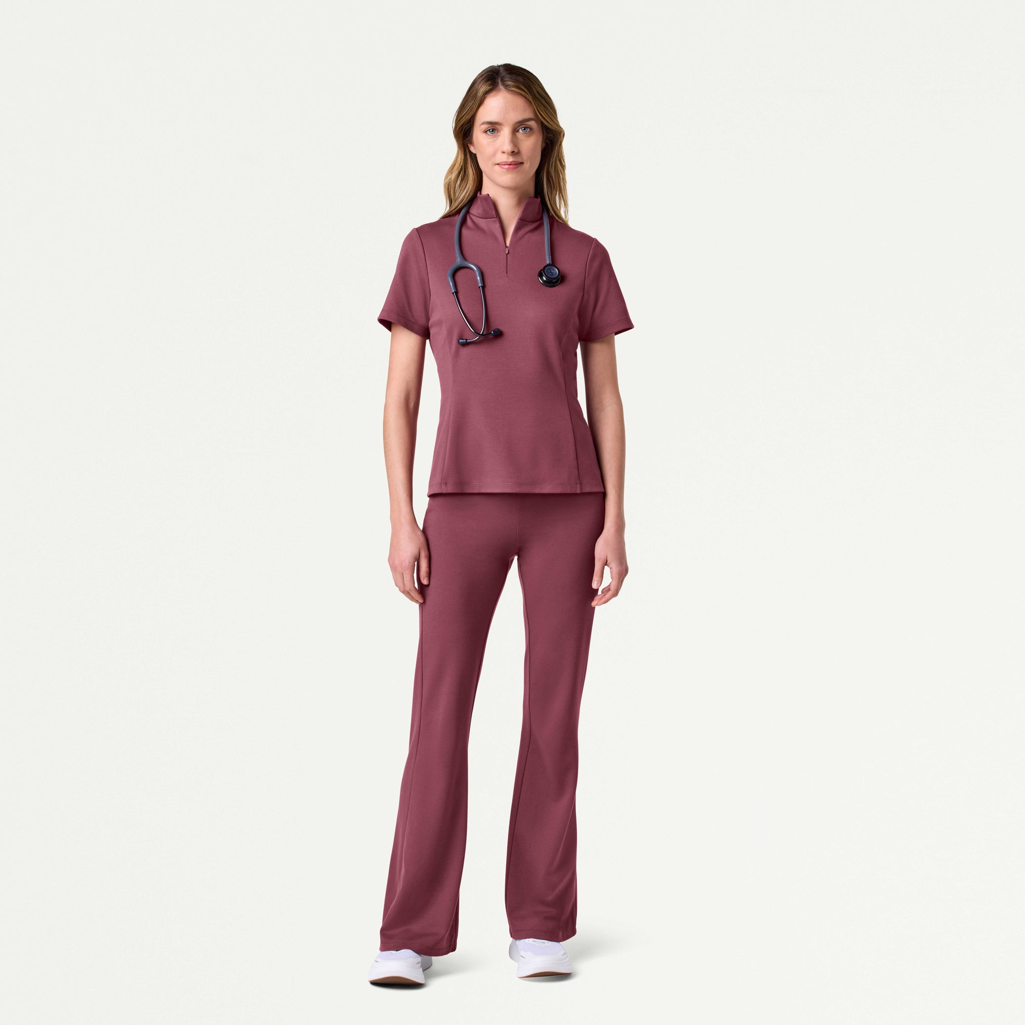 Woman wearing Rosewood scrub set