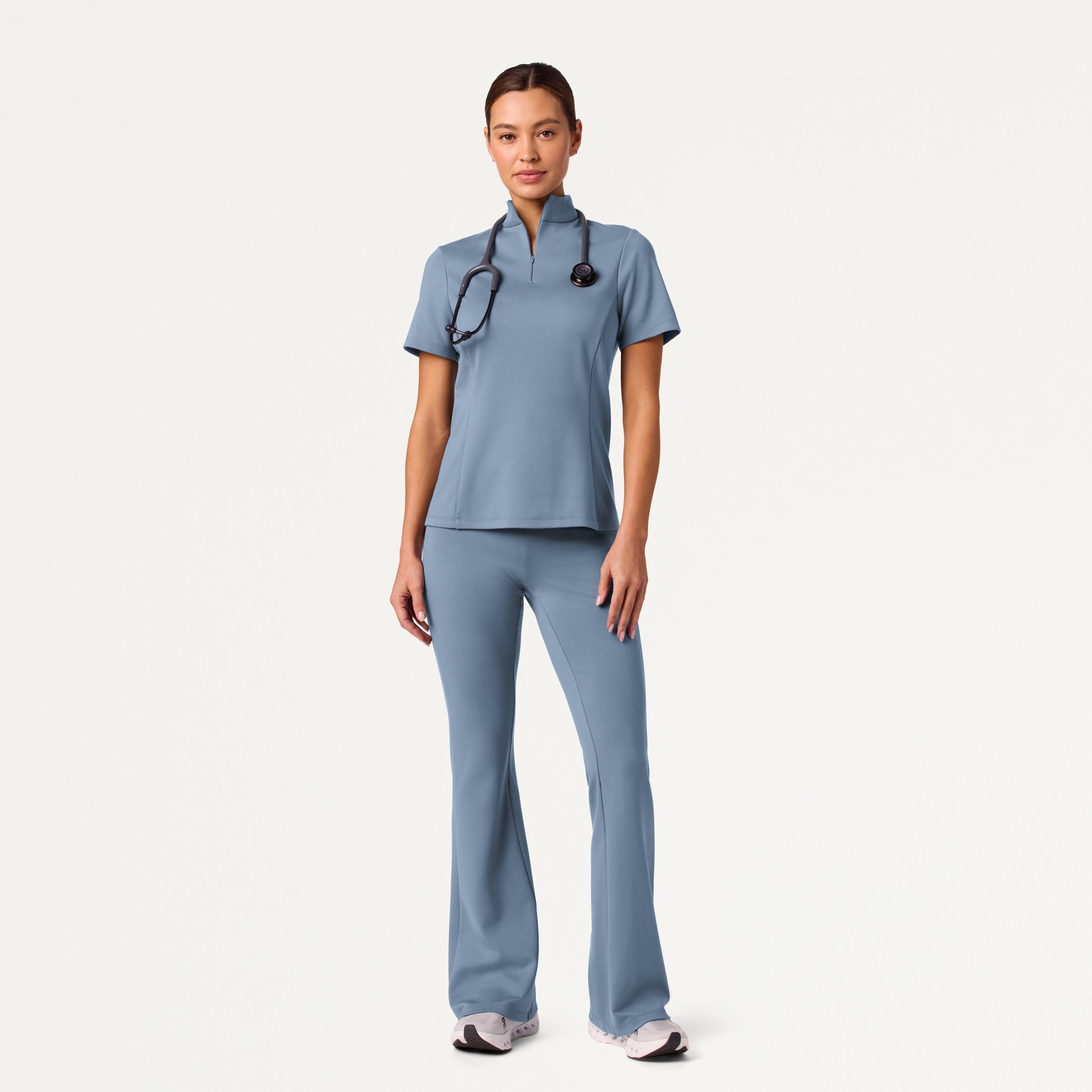 Woman wearing Storm Blue scrub set