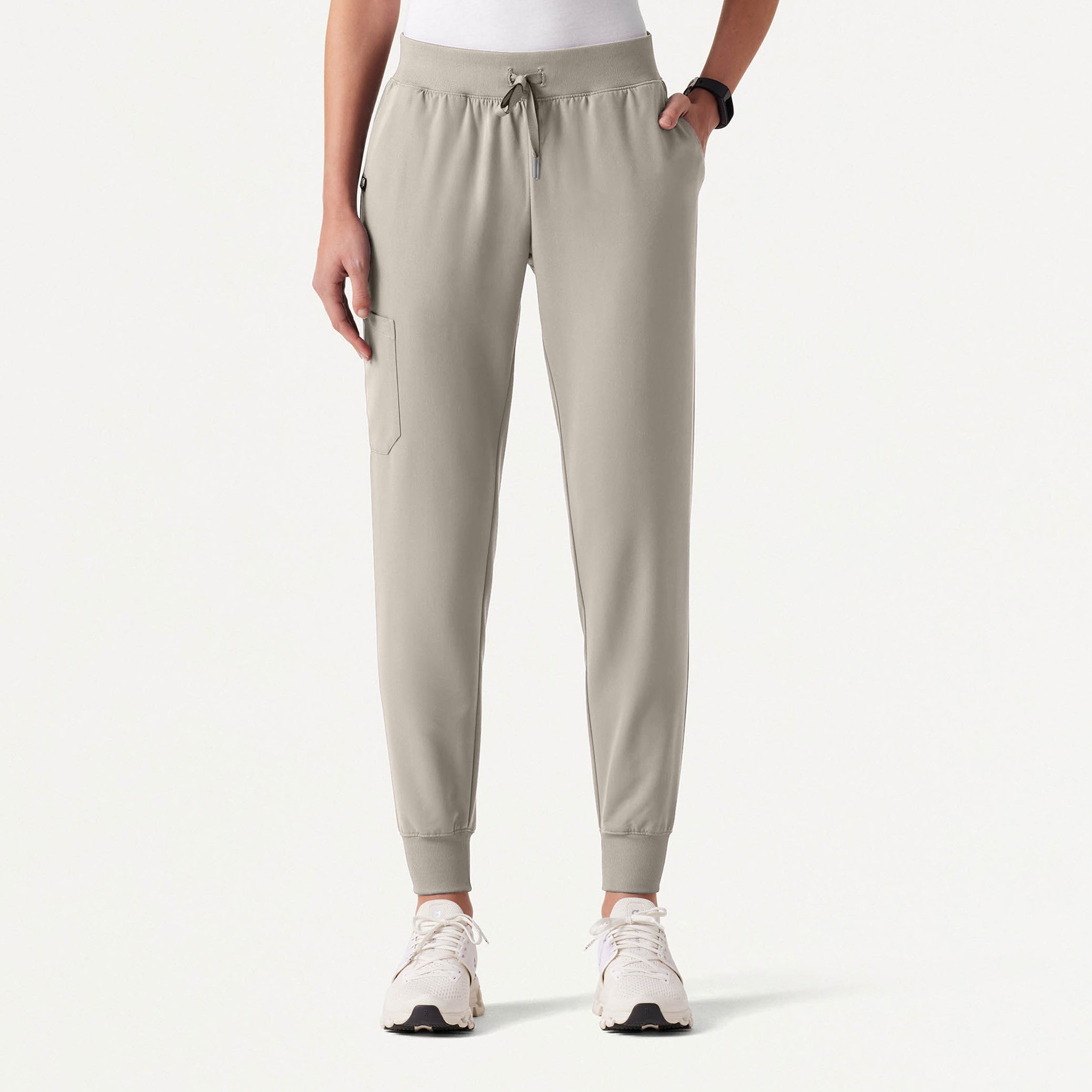 Person wearing Fog colored jogger pants on a white background