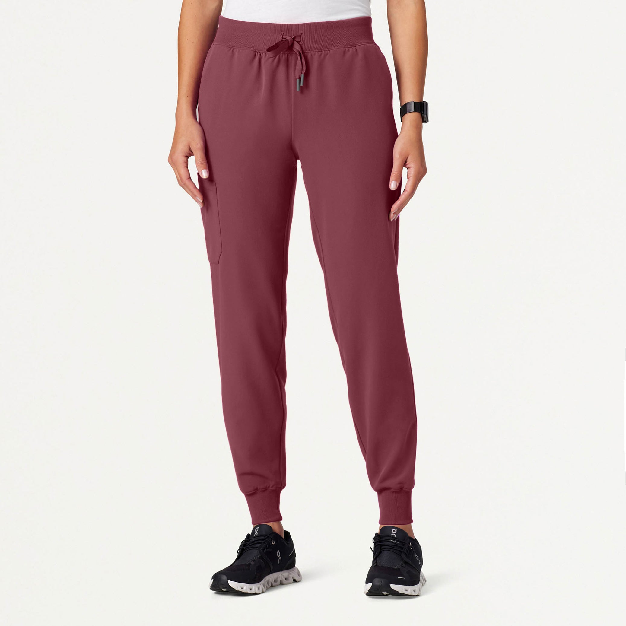 Rosewood jogger pants worn by a person on a white background