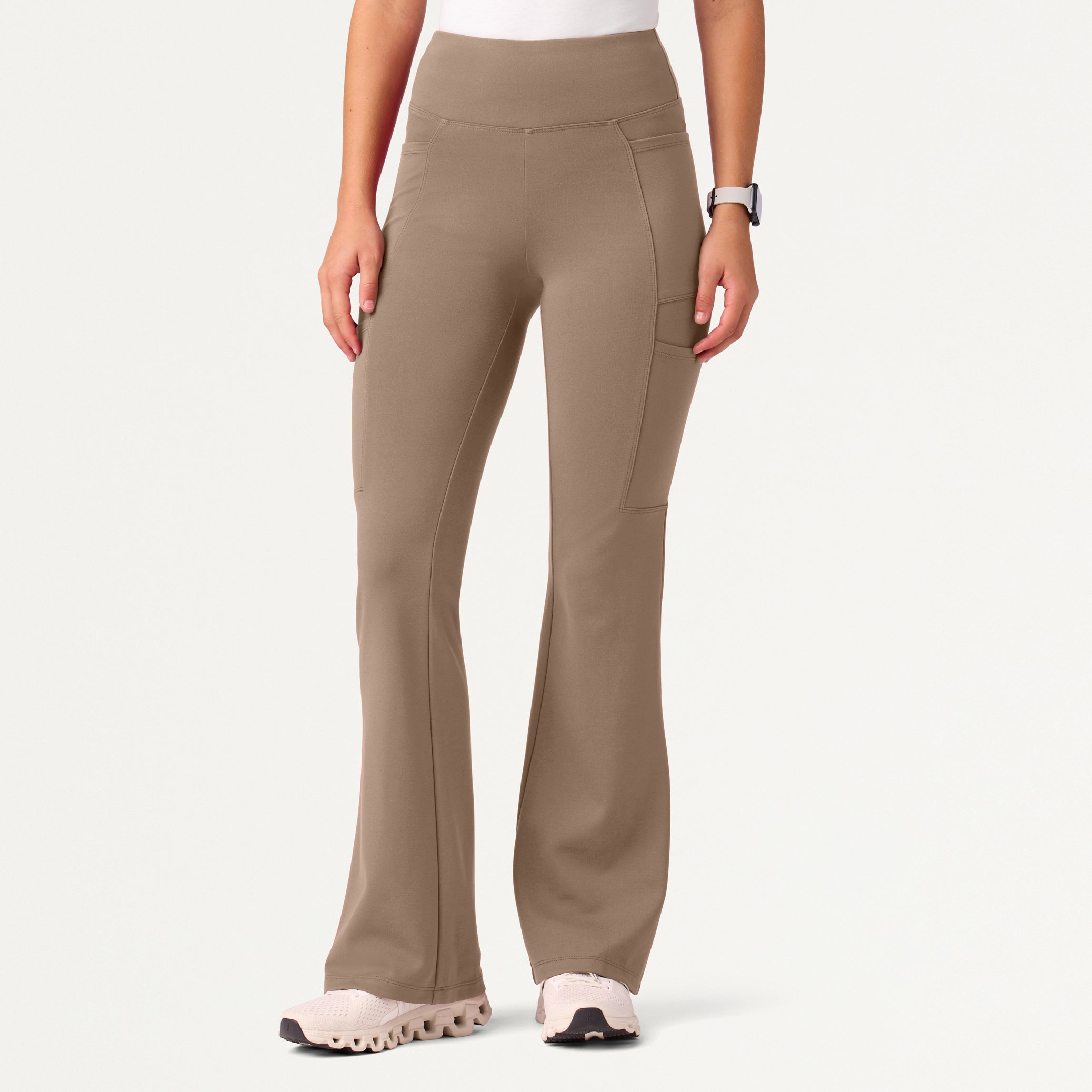 A woman wearing a Mocha scrub pant