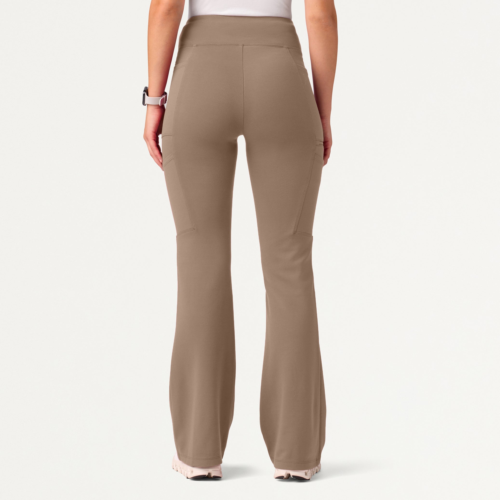 A woman wearing a Mocha scrub pant