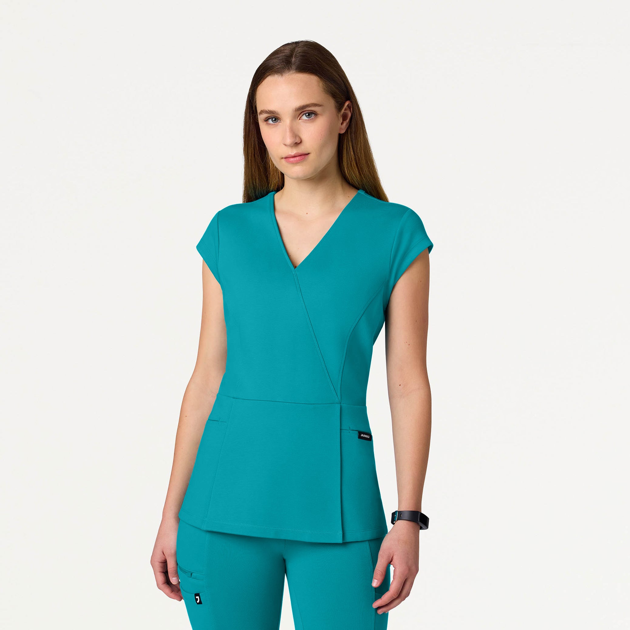 Woman wearing Teal scrub top